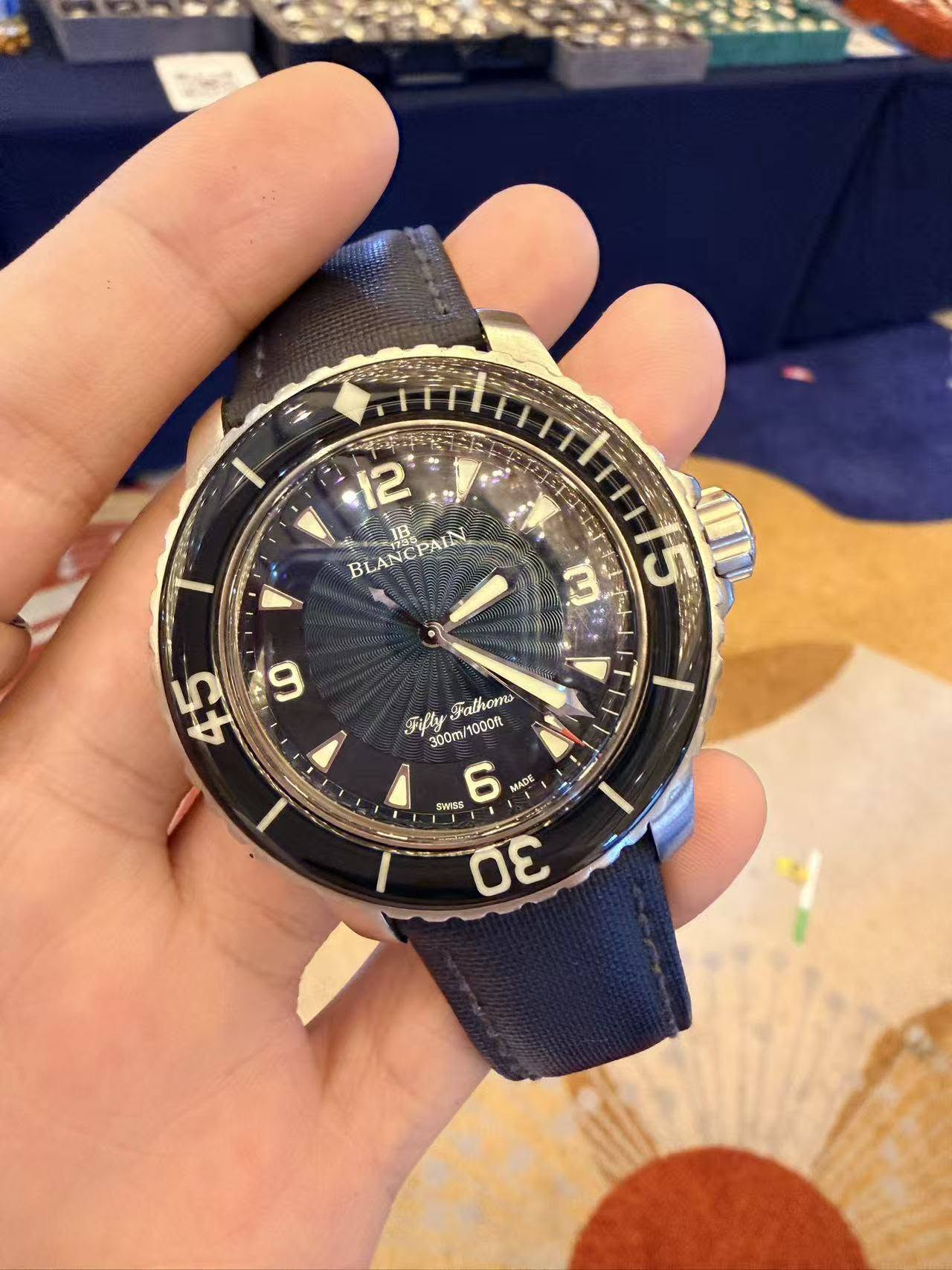 May be an image of wrist watch and text that says '1 BLANCPAIN PAIN U ቤ 45 ት ንንምክ 0 Filly Fathom 300m 1000R SAYS 6 MADE 30'