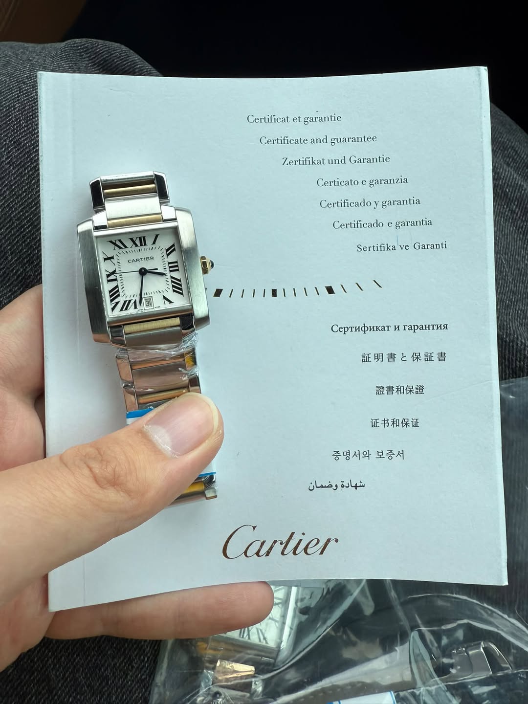 May be an image of wrist watch and text that says 'Certificat et garantie Certificate and guarantee Zertifikat und Garantie Certicato garanzia WXII XII Certificadoy garantia…
