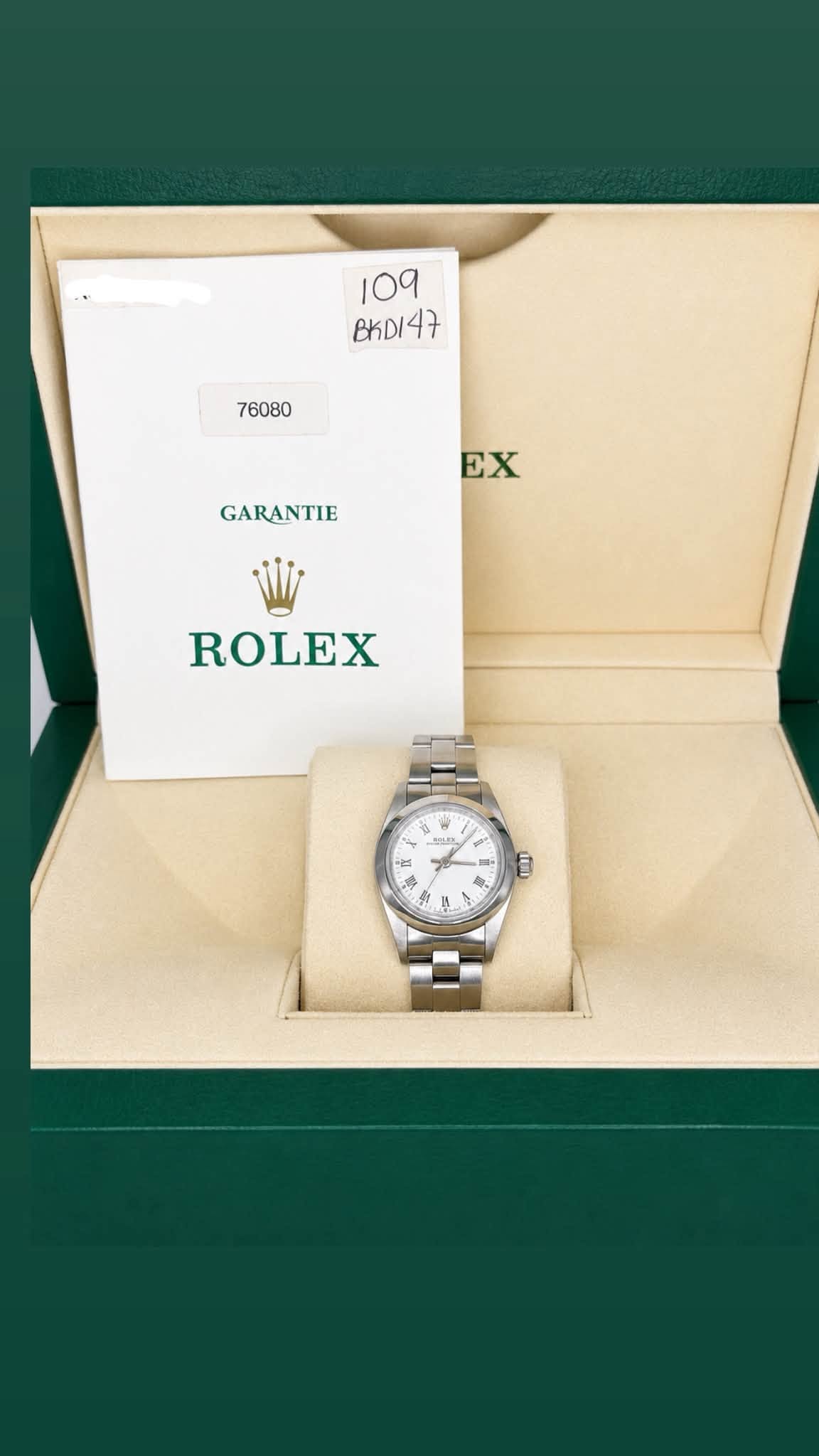 May be an image of wrist watch and text that says '109 BKDI47 47 BKDI 76080 EX GARANTIE ROLEX Ⅱ N ከ'