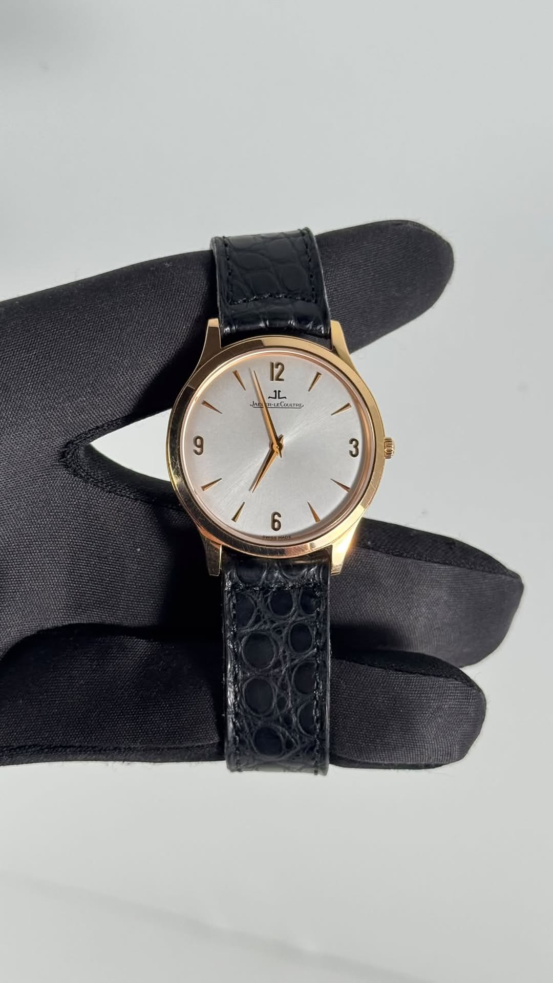 May be an image of wrist watch, leather and text
