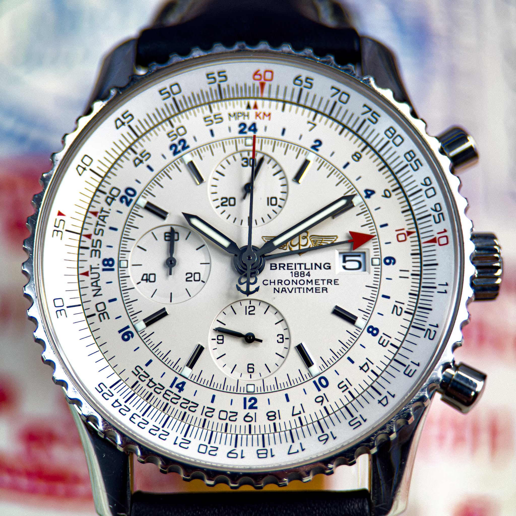 May be an image of wrist watch and text that says '55 60 salalaliti MPH KM 50 ሞመመር 24 45 יין 30 สก 20 35 35STAT. 35 NAUT. 6r BREITLING 5 RONOMETRE ETRE NAVITIMER 心 רני uhh. מי 0…