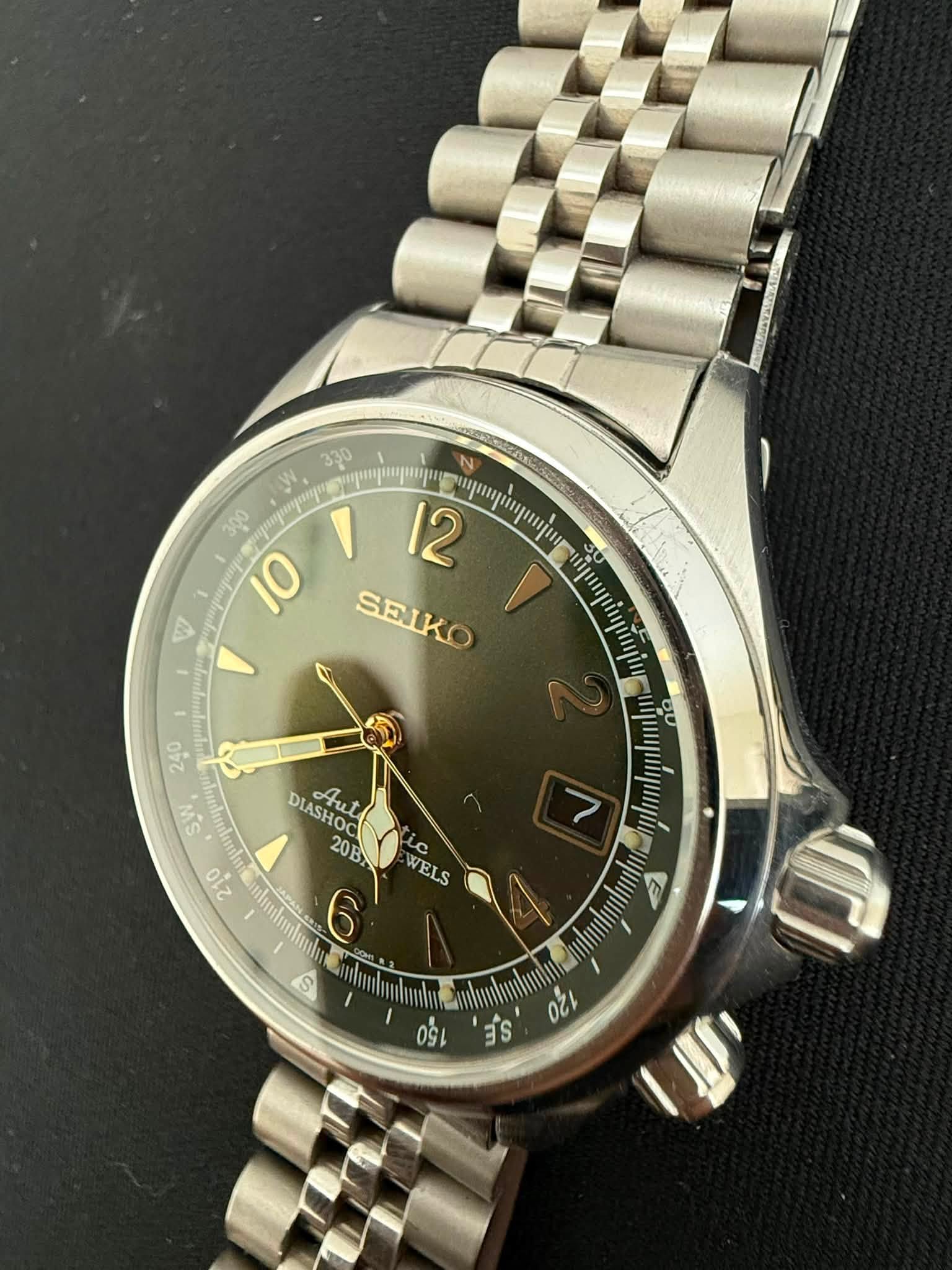 May be an image of wrist watch and text