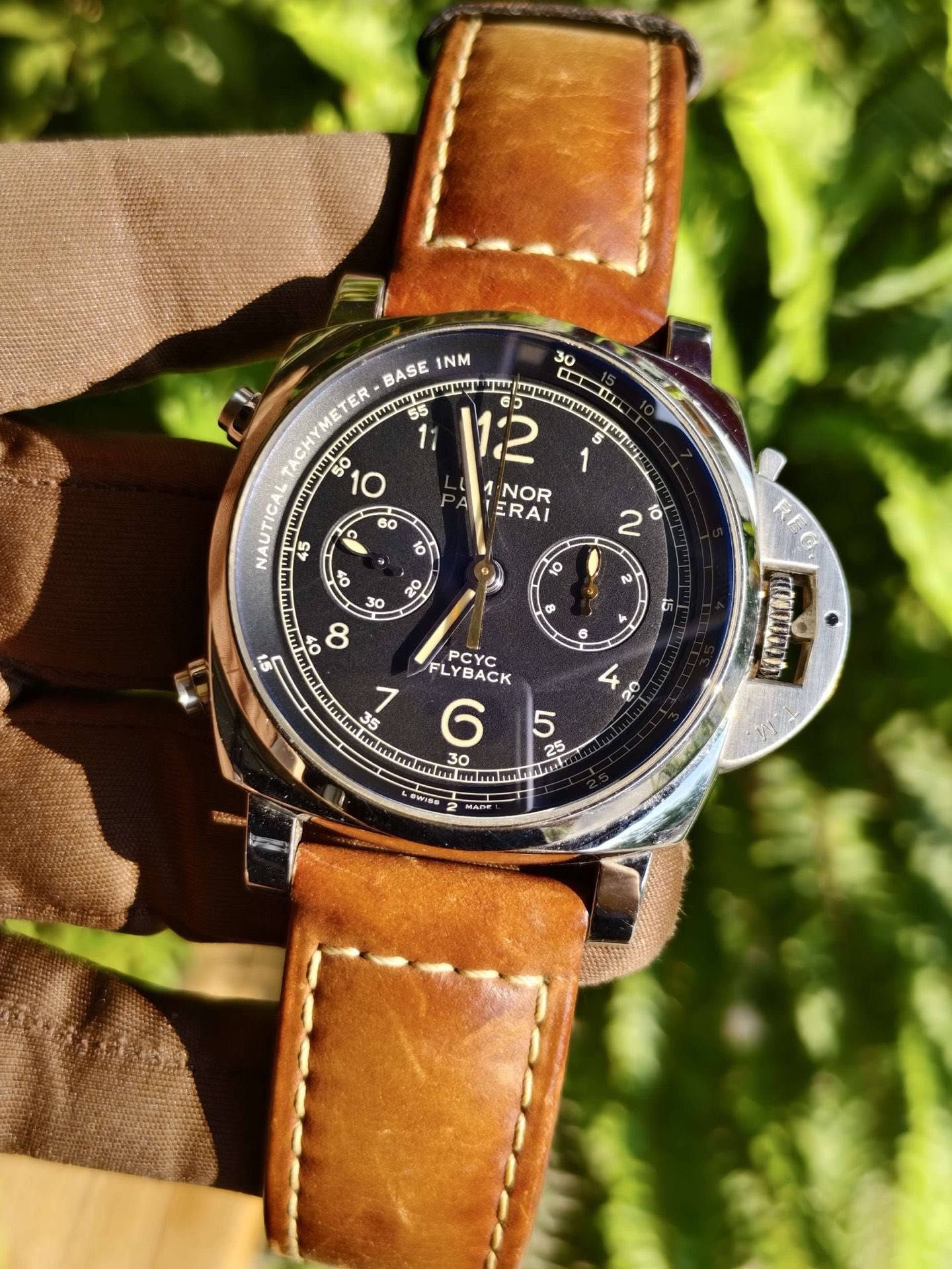 May be an image of wrist watch and text
