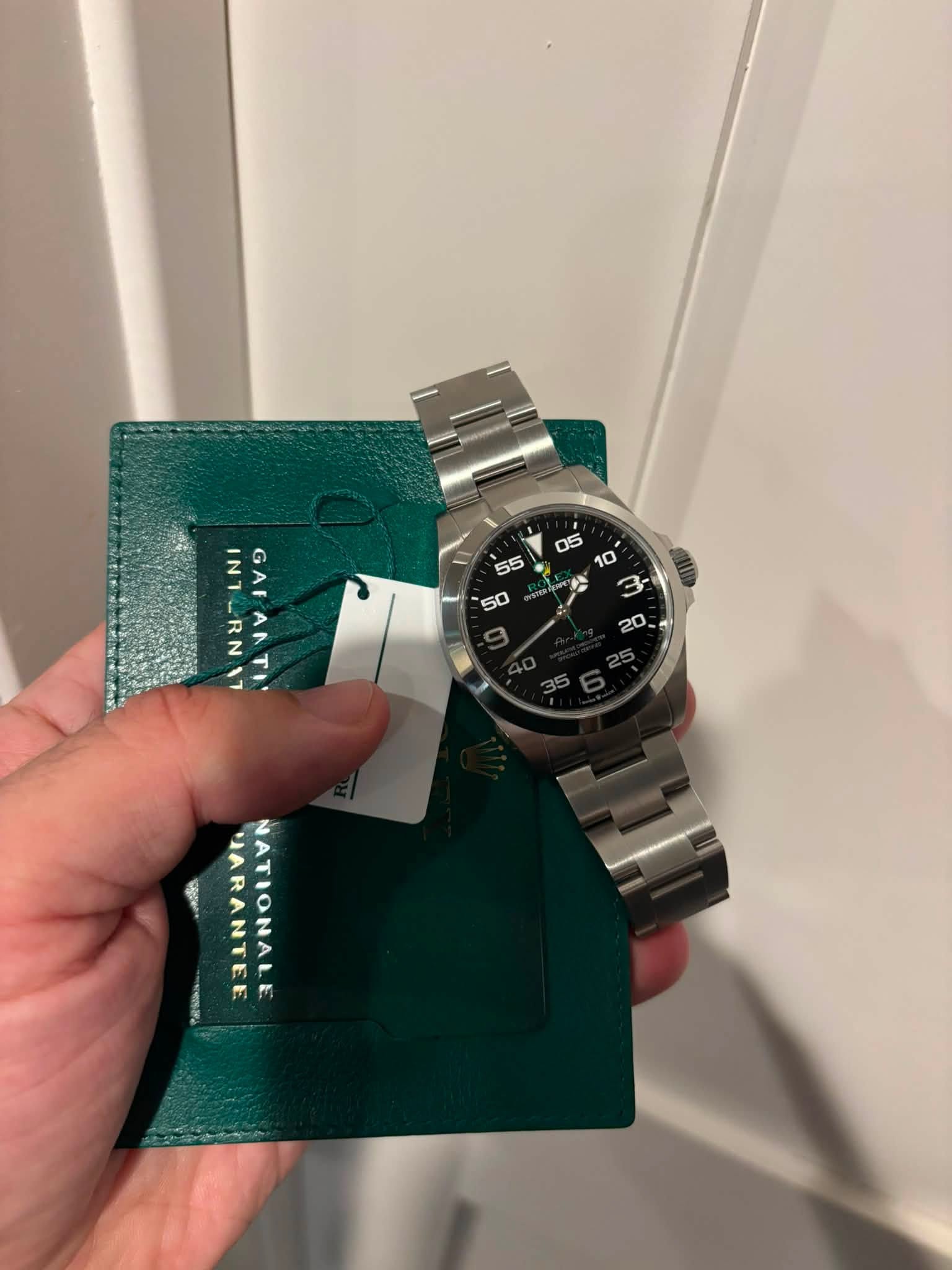 May be an image of wrist watch and text