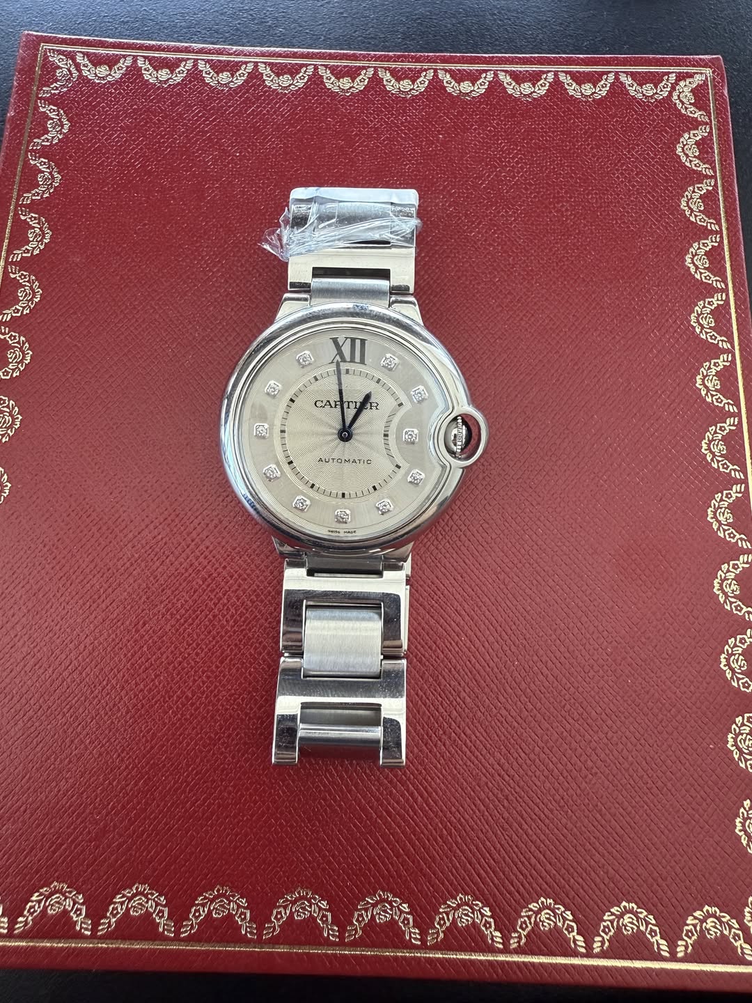 May be an image of wrist watch and text