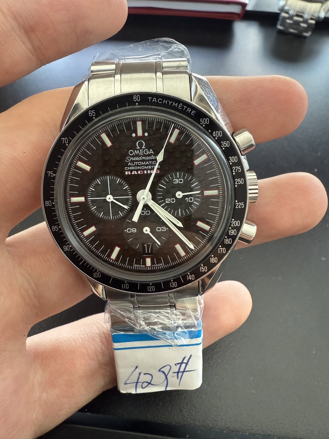 May be an image of wrist watch and text that says '60 ACHYMETRE RE ပဲ့ ۲ OMEGA Sreadmaster ΜΤ ADONOMET CHR CHRONOMET HAC ACIN 11 ፡ Vii 0 i ١ + 20 / 0 10 / / 4# 42'