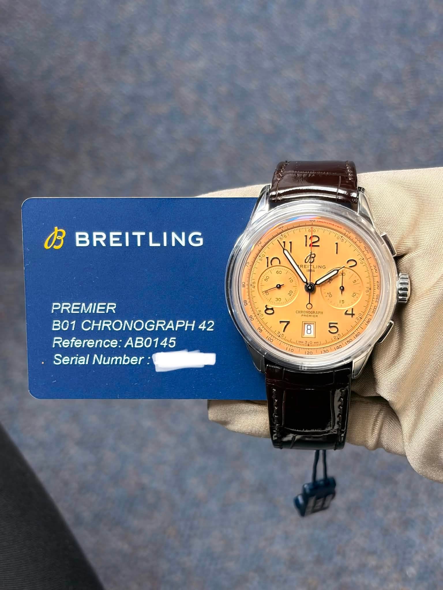 May be an image of wrist watch and text that says 'お BREITLING 1 12 1n 由 REITL FLING ING 60 0" အ 2 o 2 ٥ o 4 ٥ ١ ១ 0 6 PREMIER B01 CHRONOGRAPH 42 Reference: Reference:AB0145…