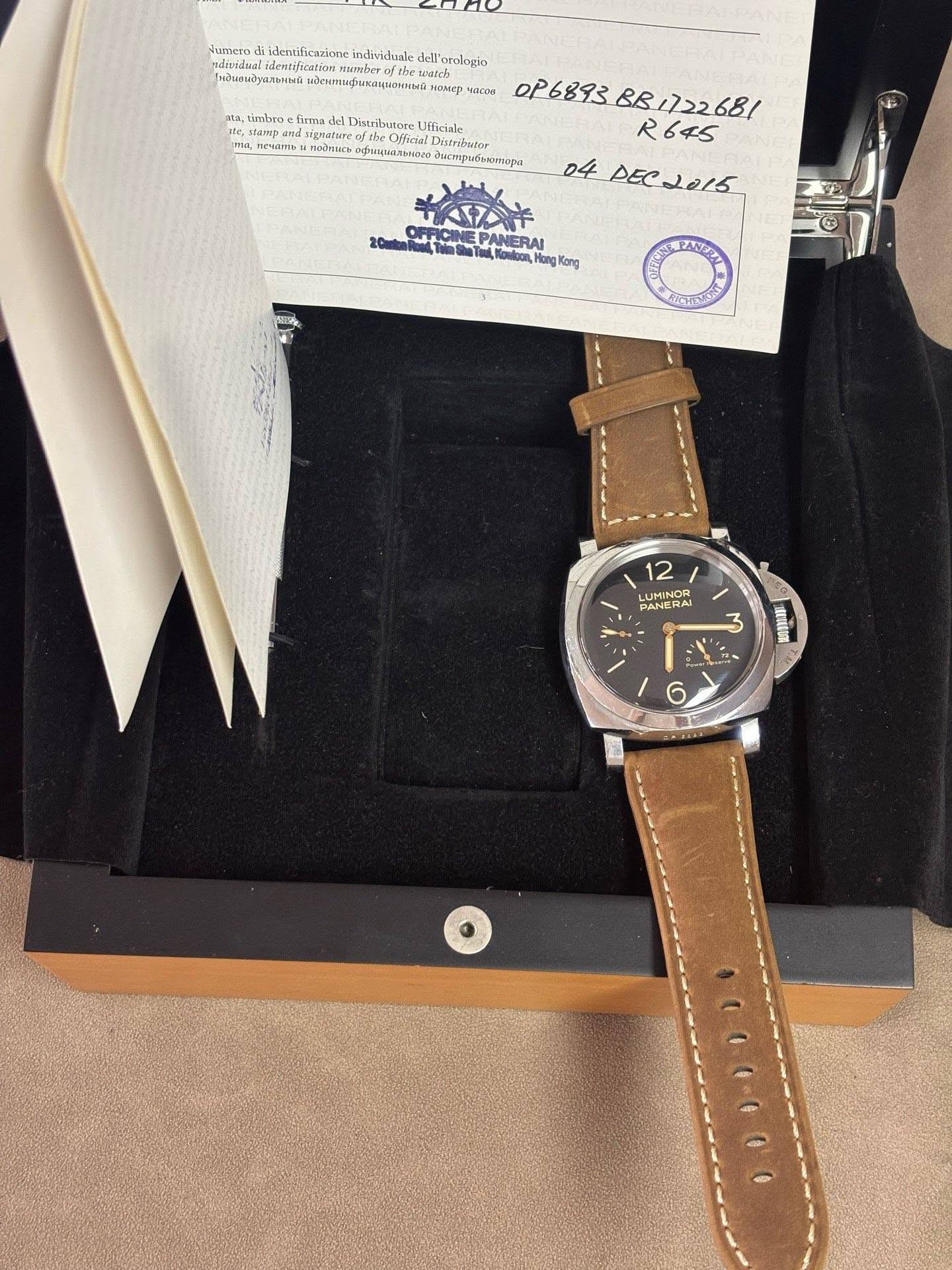 May be an image of wrist watch, leather and text