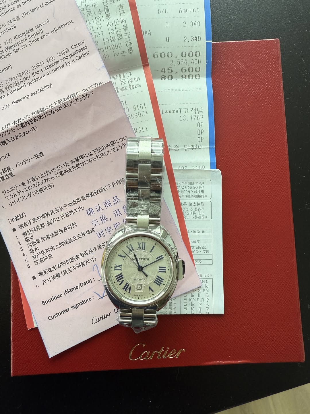 May be an image of wrist watch and text