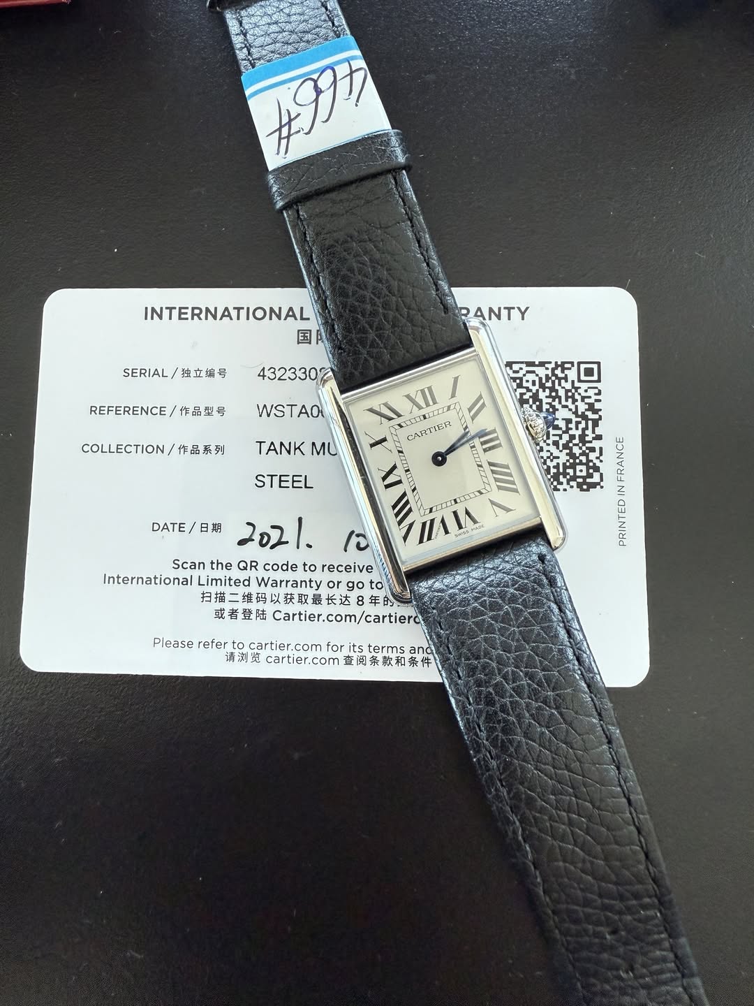 May be an image of leather, wrist watch and text