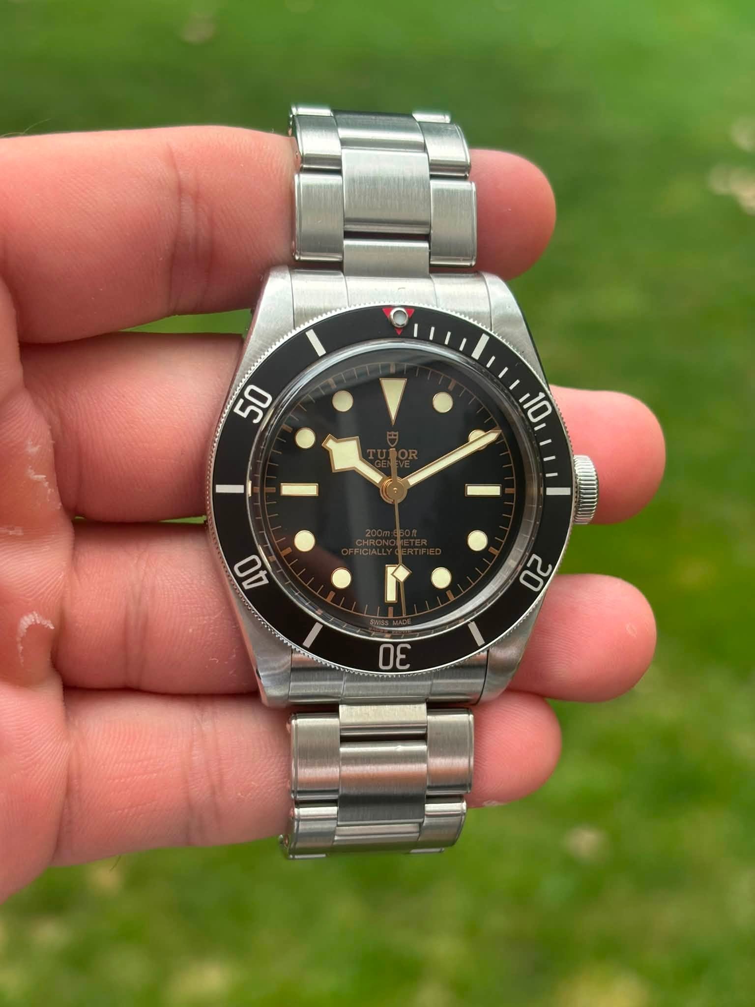 May be an image of wrist watch and text