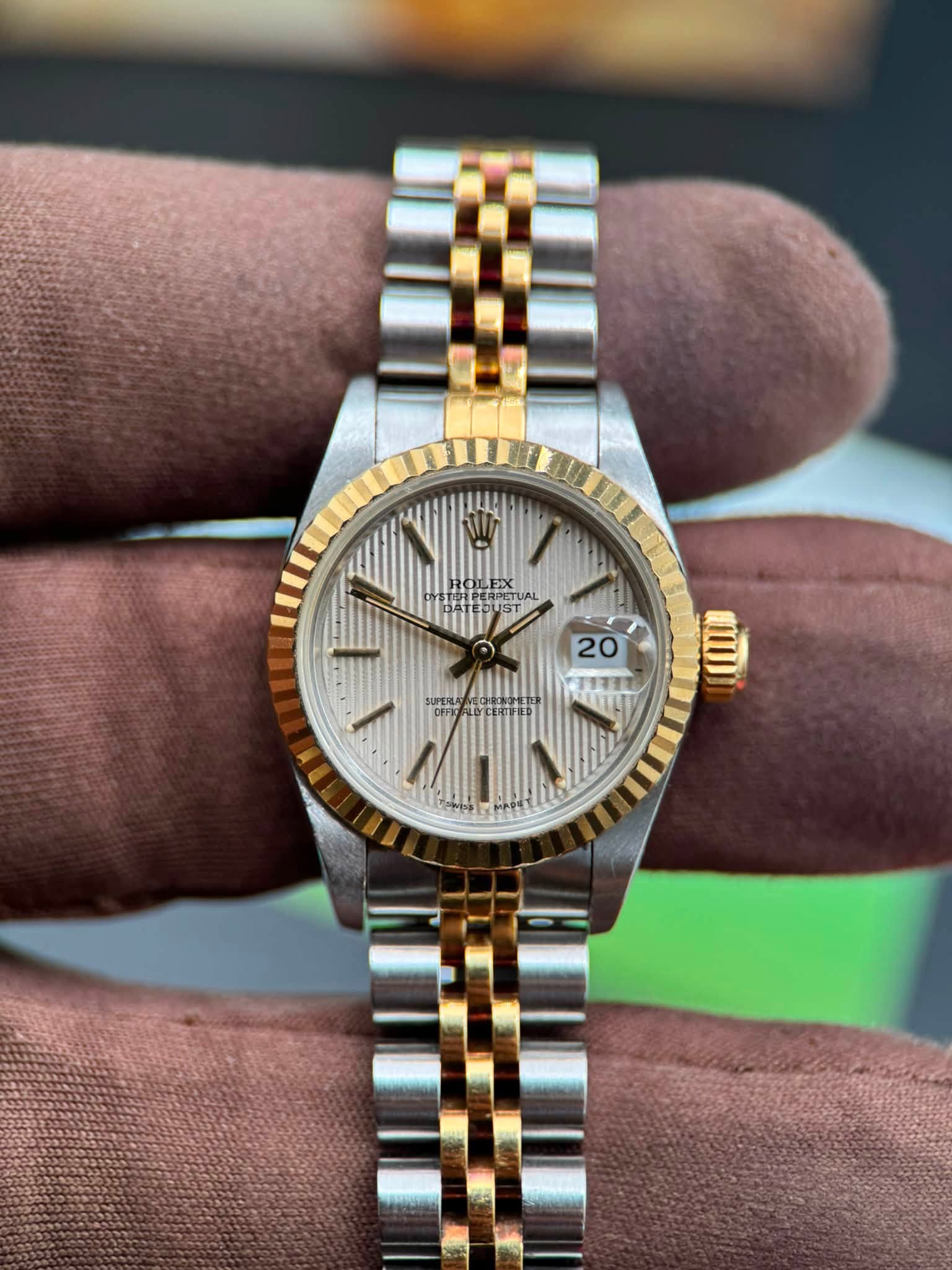 May be an image of wrist watch and text