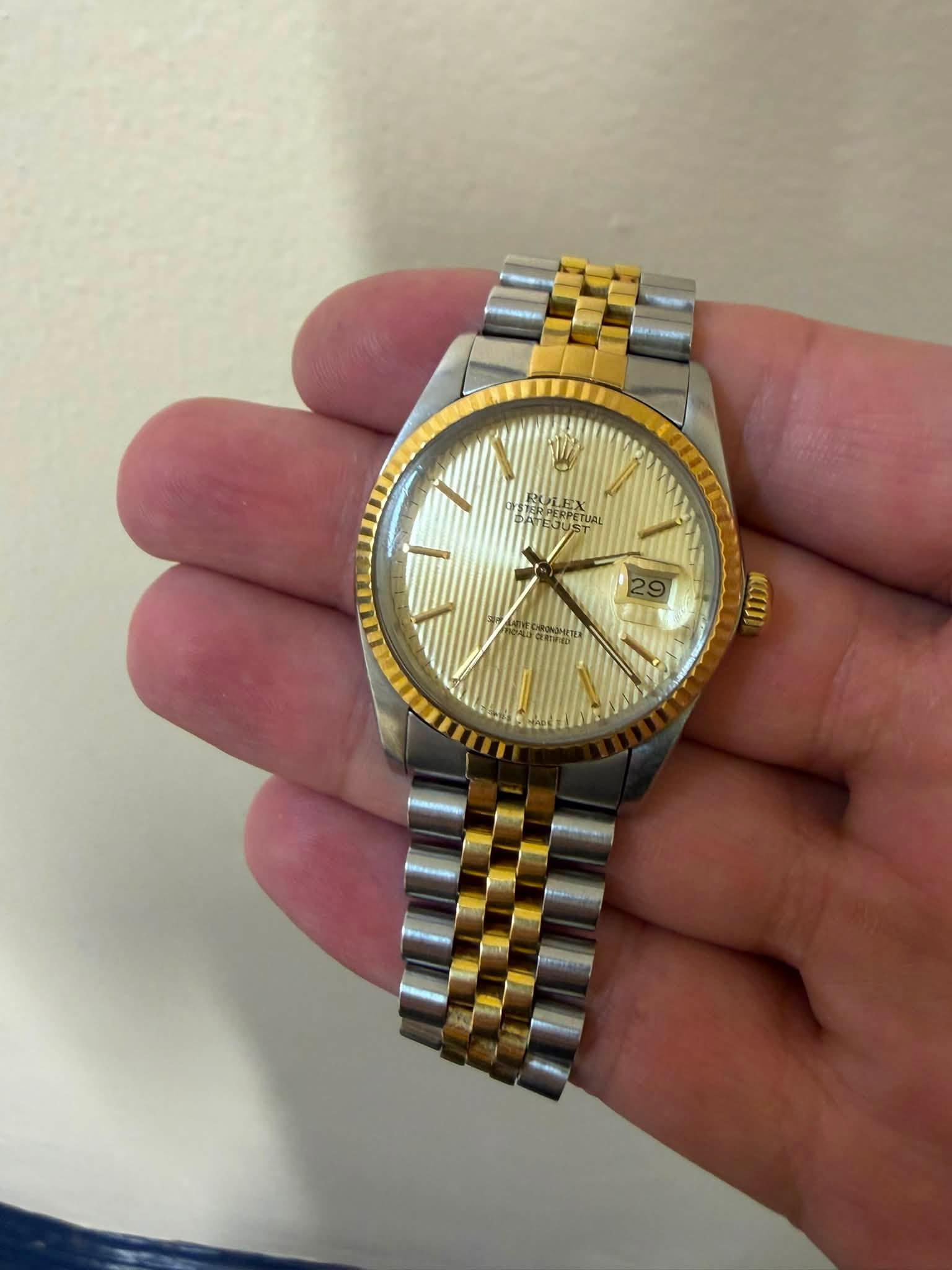 May be an image of wrist watch and text