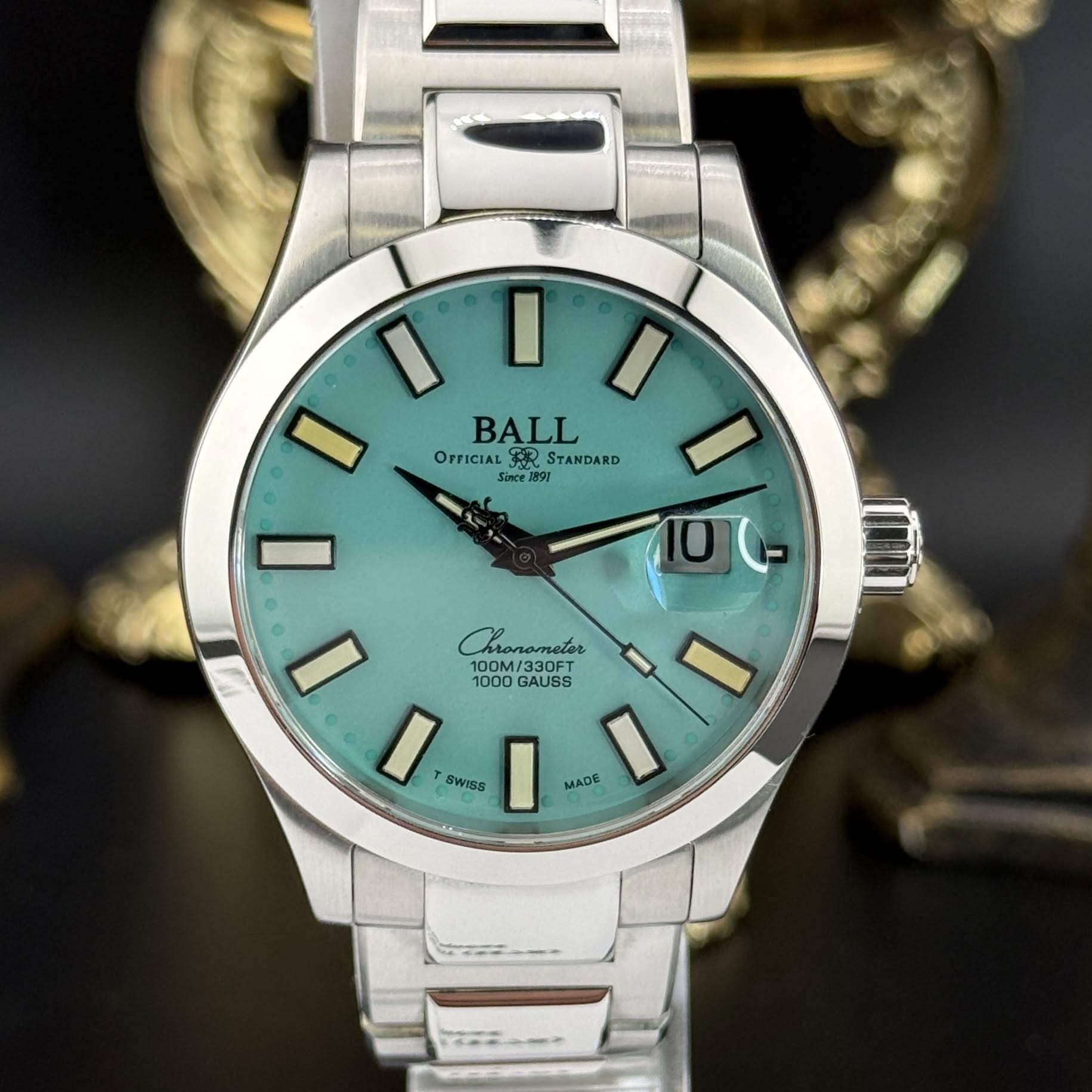May be an image of wrist watch and text that says 'I01 I BALL OPFICIAL OPFICIALFERSTANDARD अर STANDARD Since1891 1091 fince I I Chrorameter 大 Pronometer 0M/330FT OFT 1000 100M…