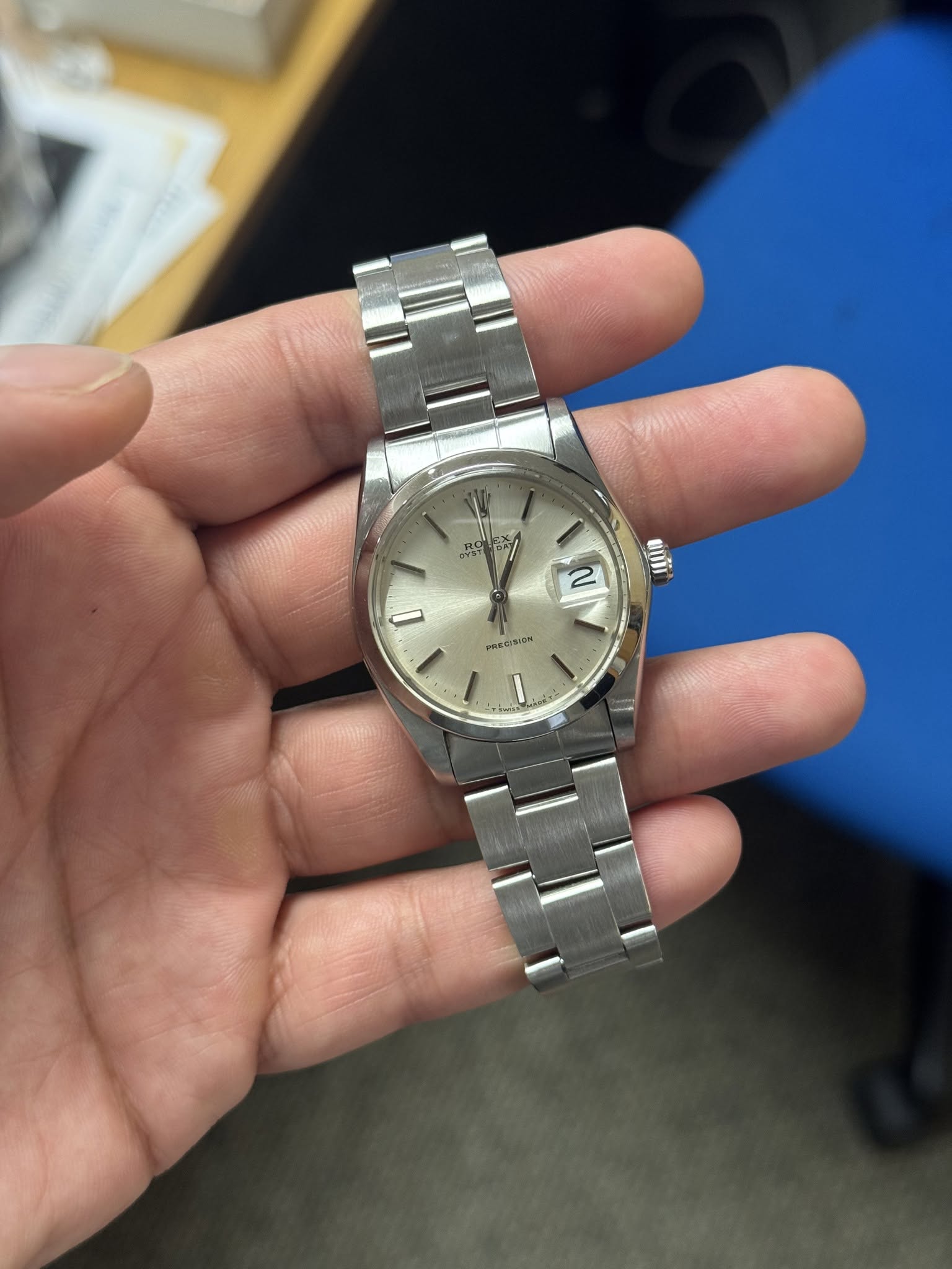 May be an image of wrist watch and text