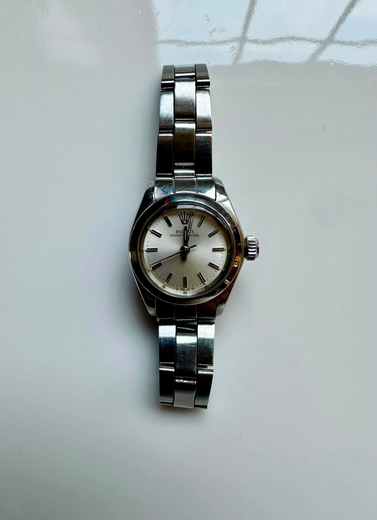 May be an image of wrist watch and text