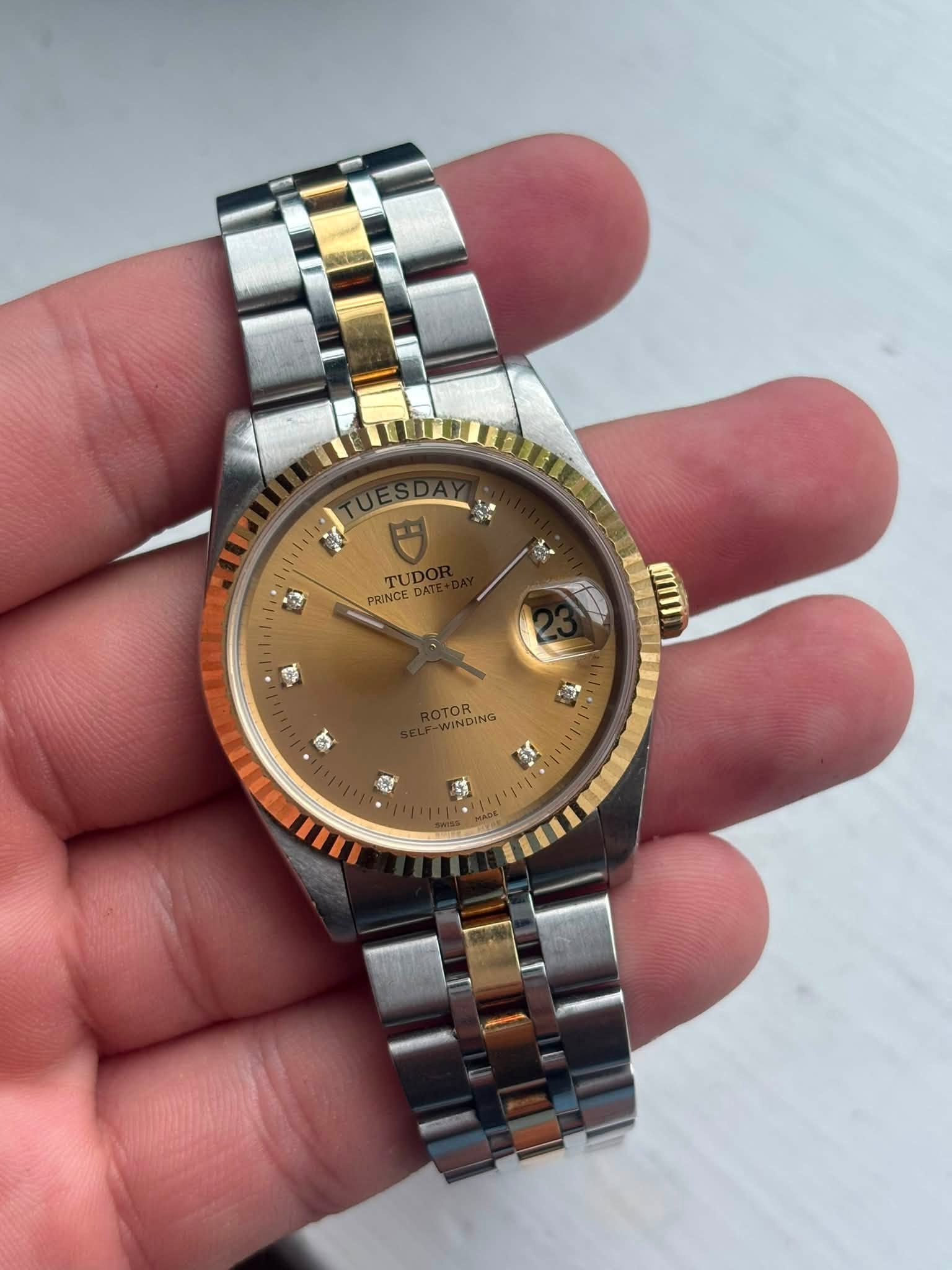 May be an image of wrist watch and text that says 'a TUD PRINCE NINDING I'