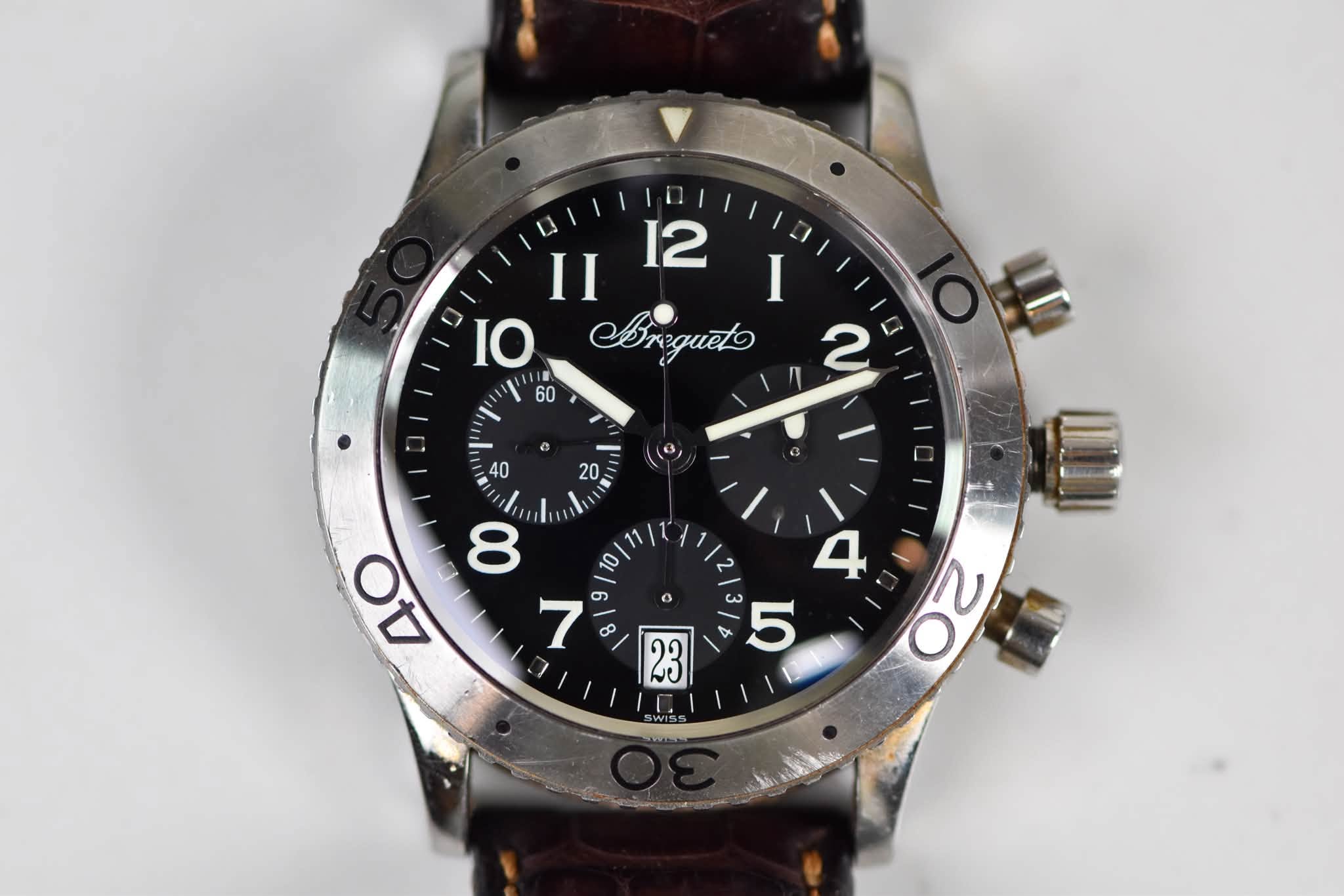 May be an image of wrist watch and text that says 'II 12 I IO Ergueto 2 60 = တ 0 4 O ٢٥ o 213/ 4 5 23'