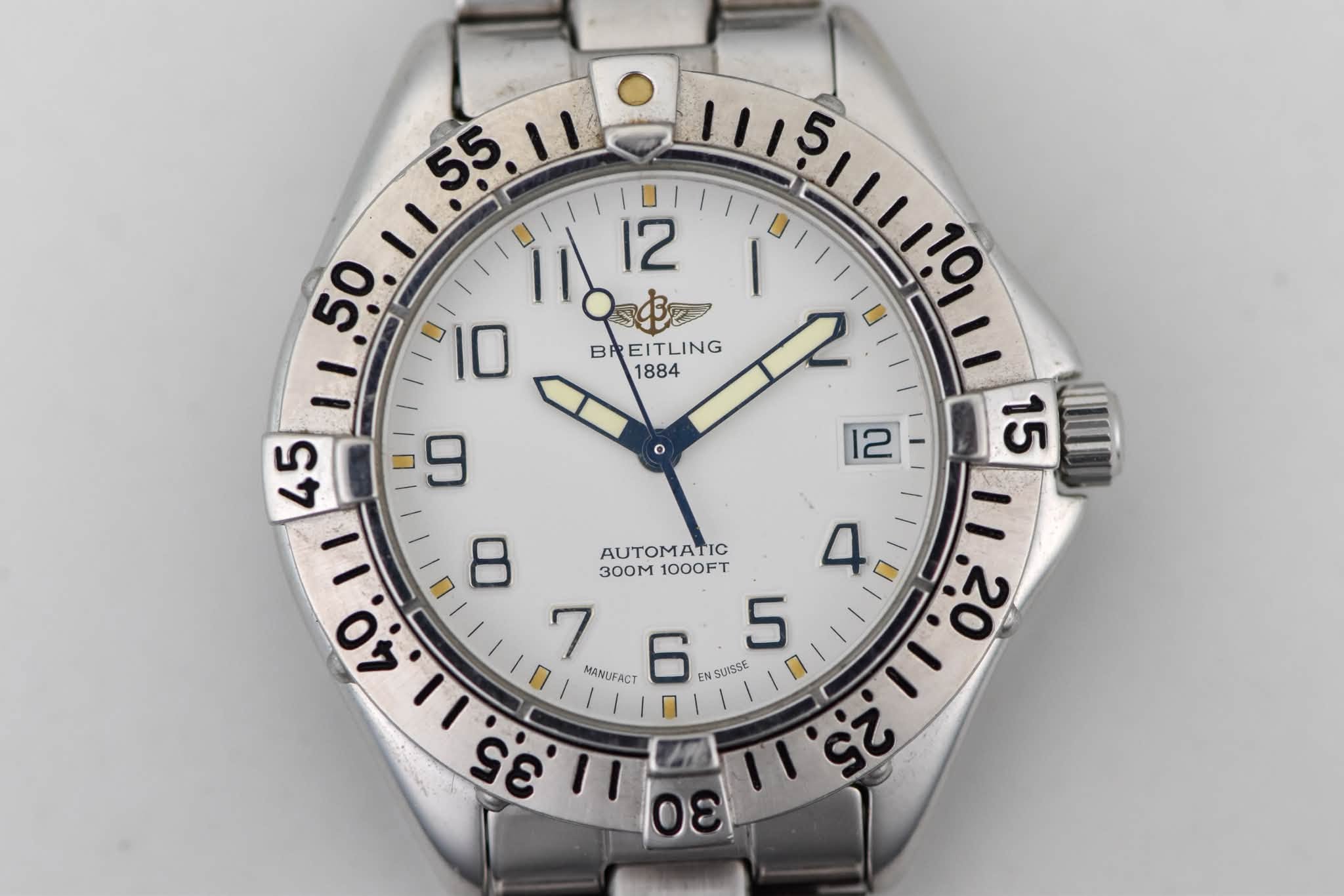 May be an image of wrist watch and text that says ' $ នៅន!ងើ 12 50 BD BREITLING B UOI AUTOMATIC 3o0M 1000FT ١ I 20 MANUFACT 6 EN SURSSE 35 ١١ La 9 00 川こ فی ന'