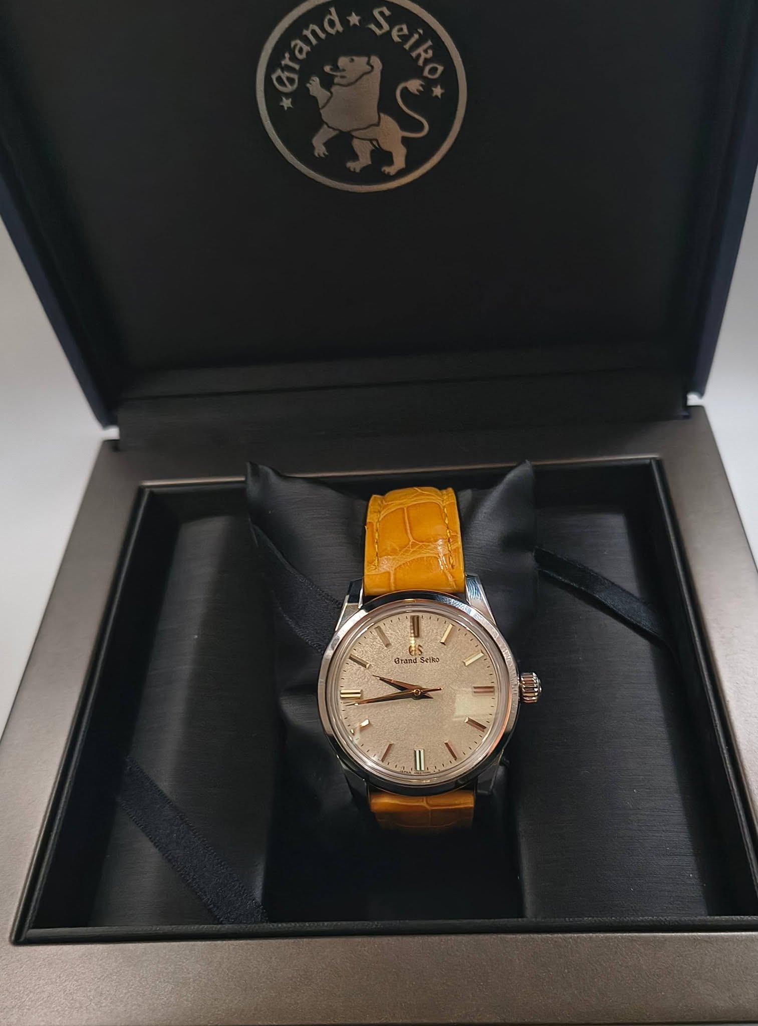 May be an image of wrist watch and text