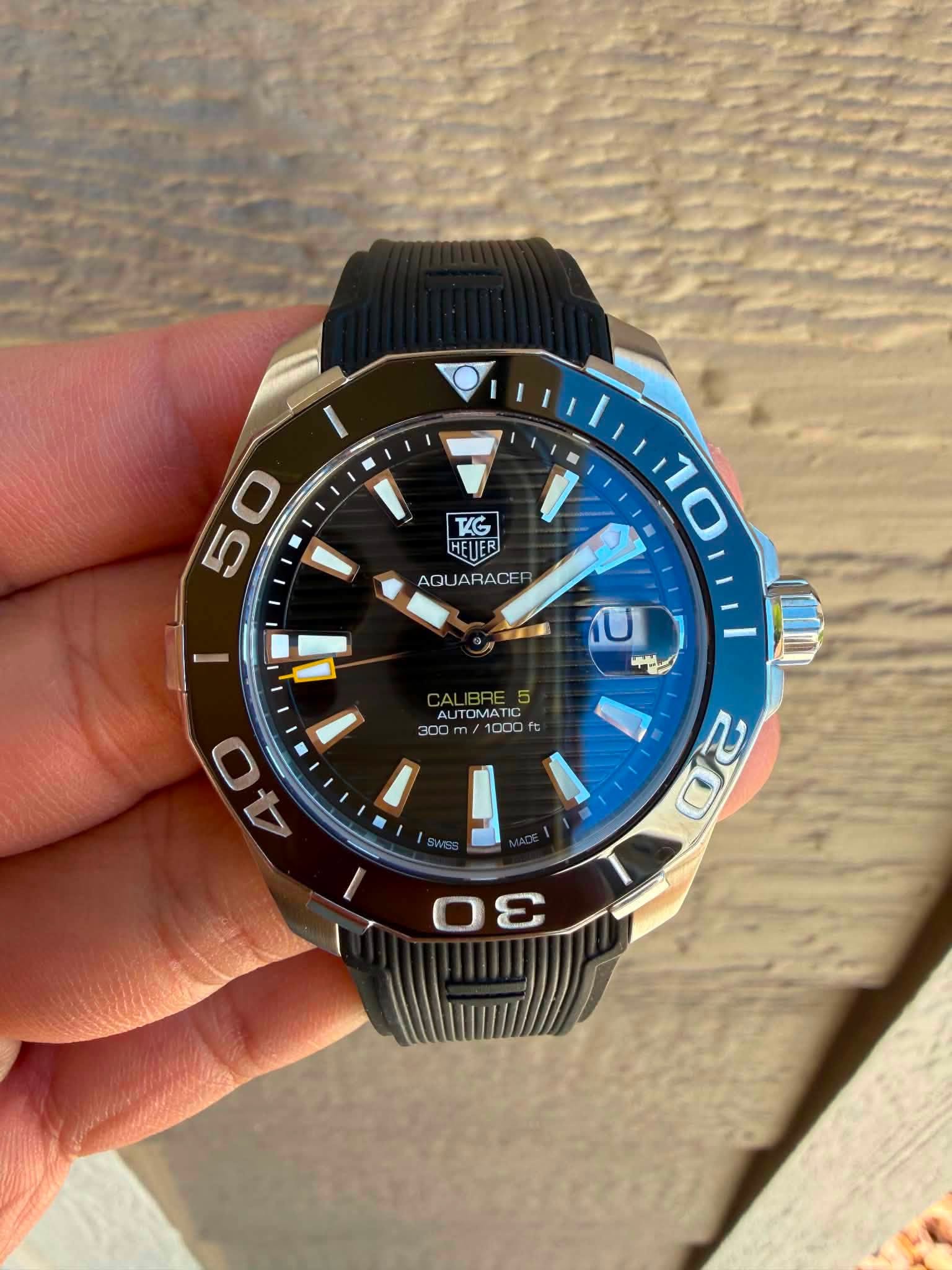 May be an image of wrist watch and text that says 'TG HEIJER AQUARACE ARACE AQU 50 5 미 40 0 300m/1000fs AL 300 1000 บ ییی Z 0ε S'