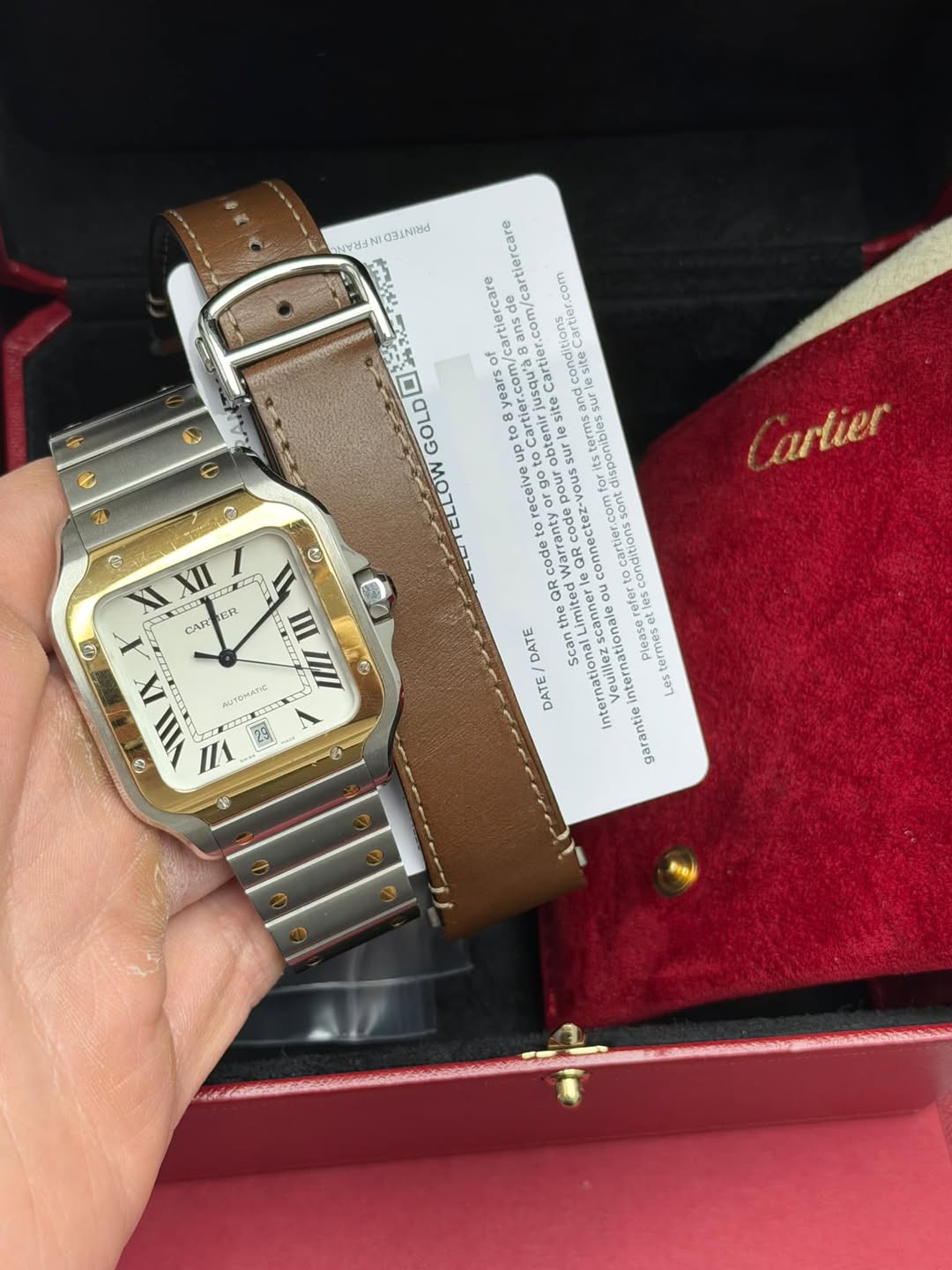 May be an image of wrist watch and text