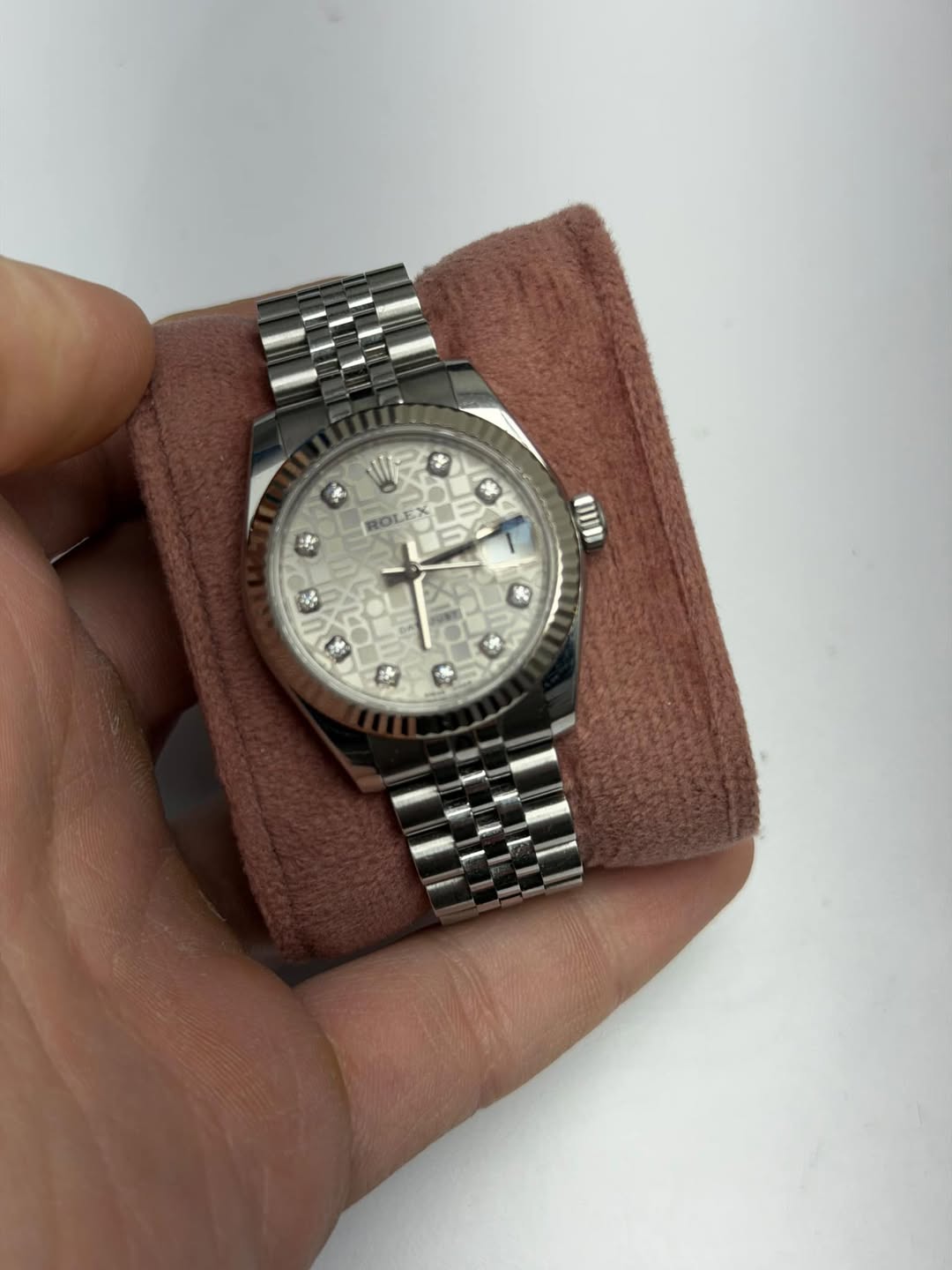 May be an image of wrist watch and text
