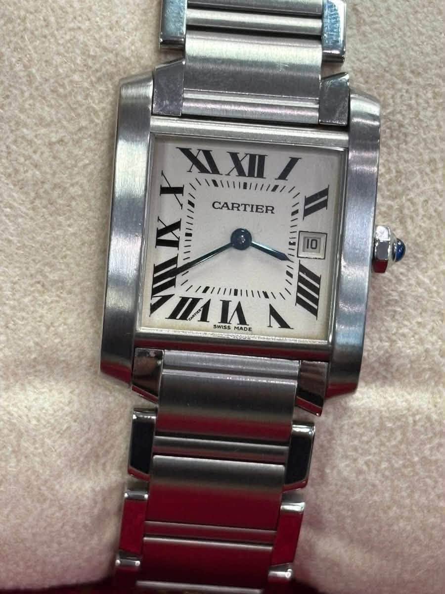 May be an image of wrist watch and text