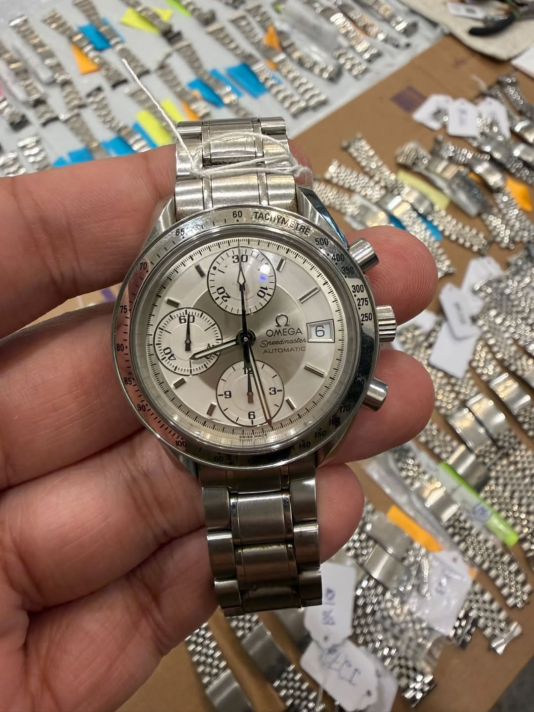 May be an image of wrist watch and text