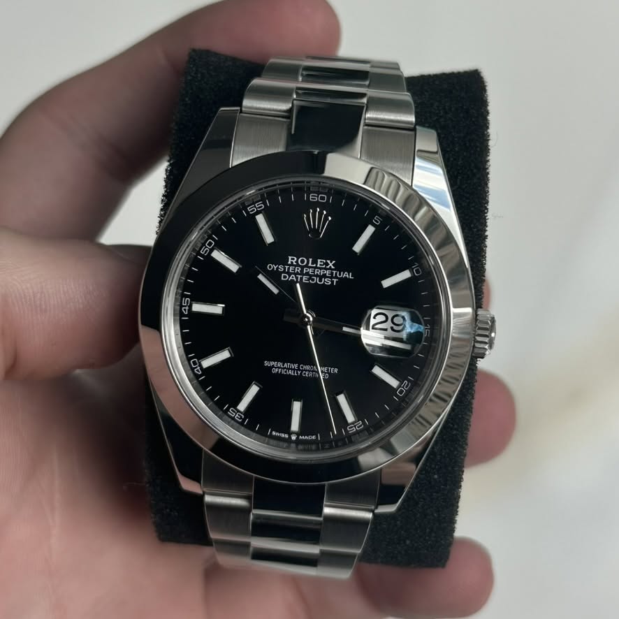 May be an image of wrist watch and text that says '60 55 50 OYS ROLEX DA DAT OTAESUSTUAL DATE RPERPE JUS UAL A 145 LI 29 40 I PERLATIVEC ICIALLT ETER S0 O RANS MAD 30'