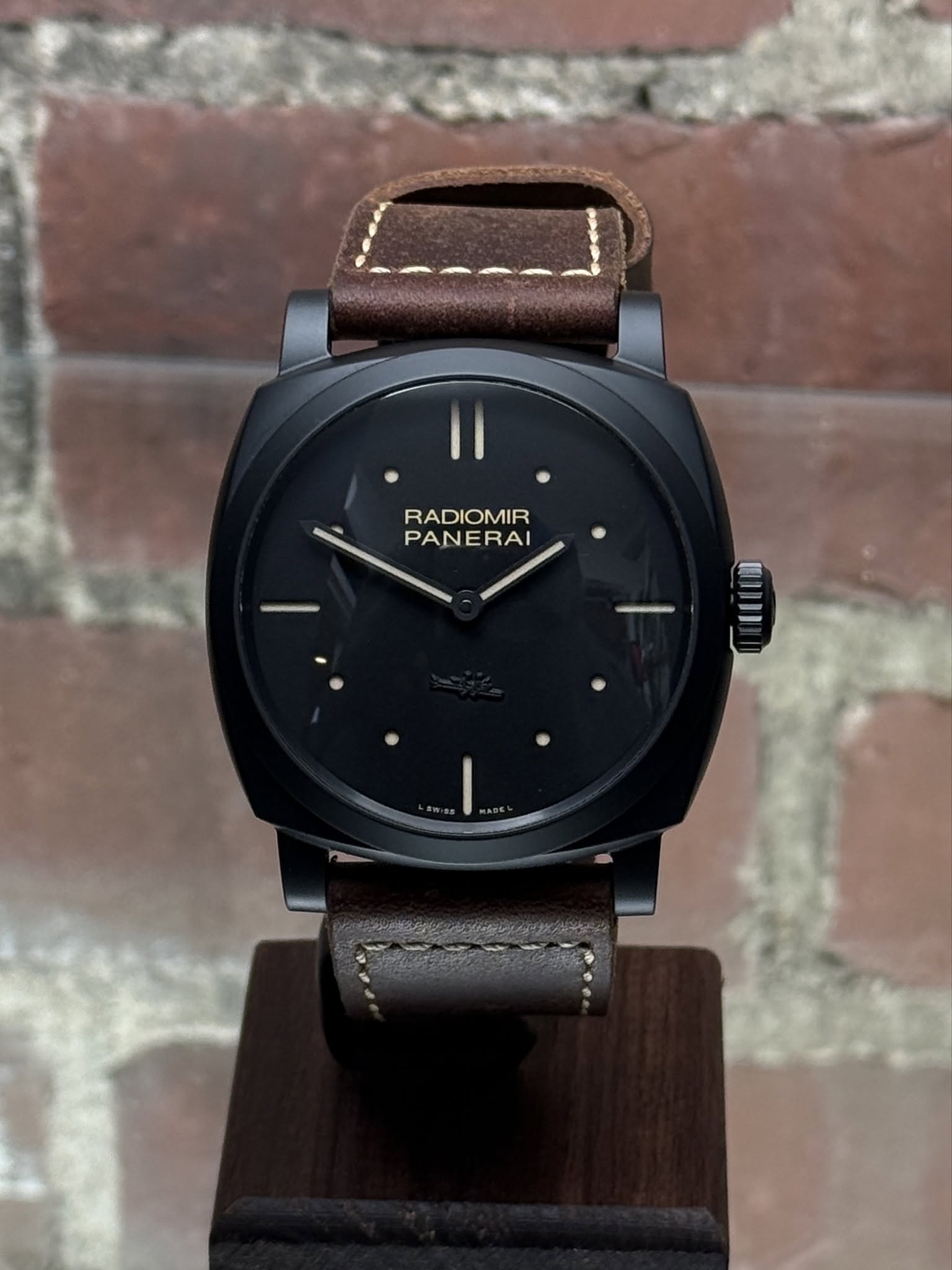 May be an image of wrist watch, leather and text