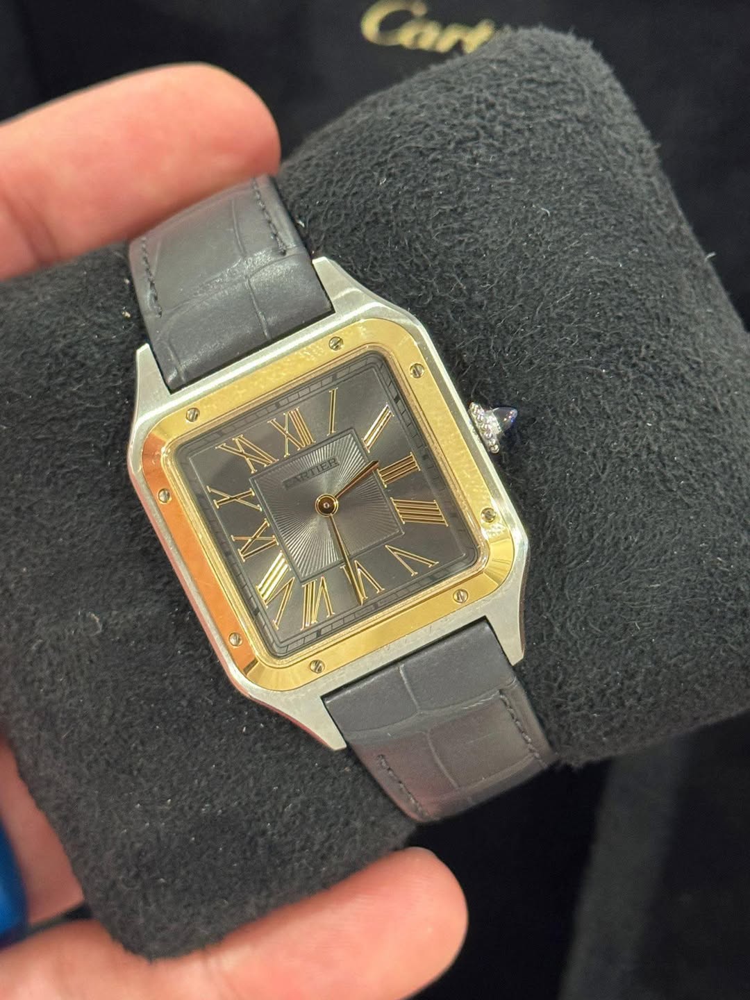May be an image of wrist watch and text
