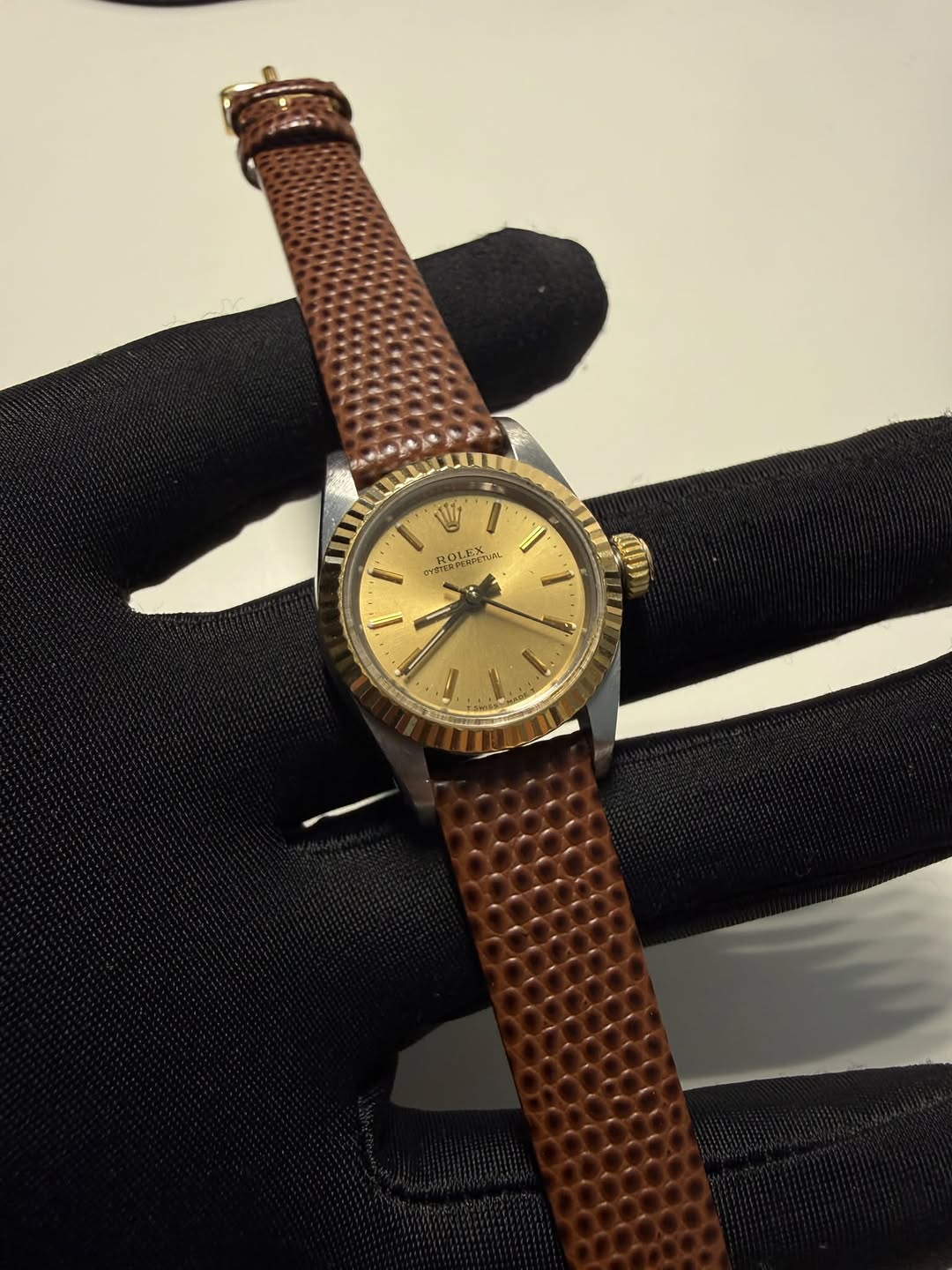 May be an image of wrist watch and text
