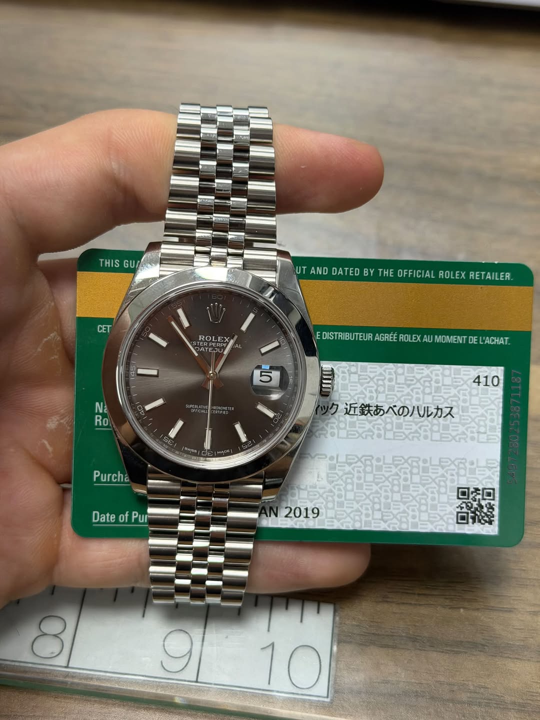 May be an image of wrist watch and text