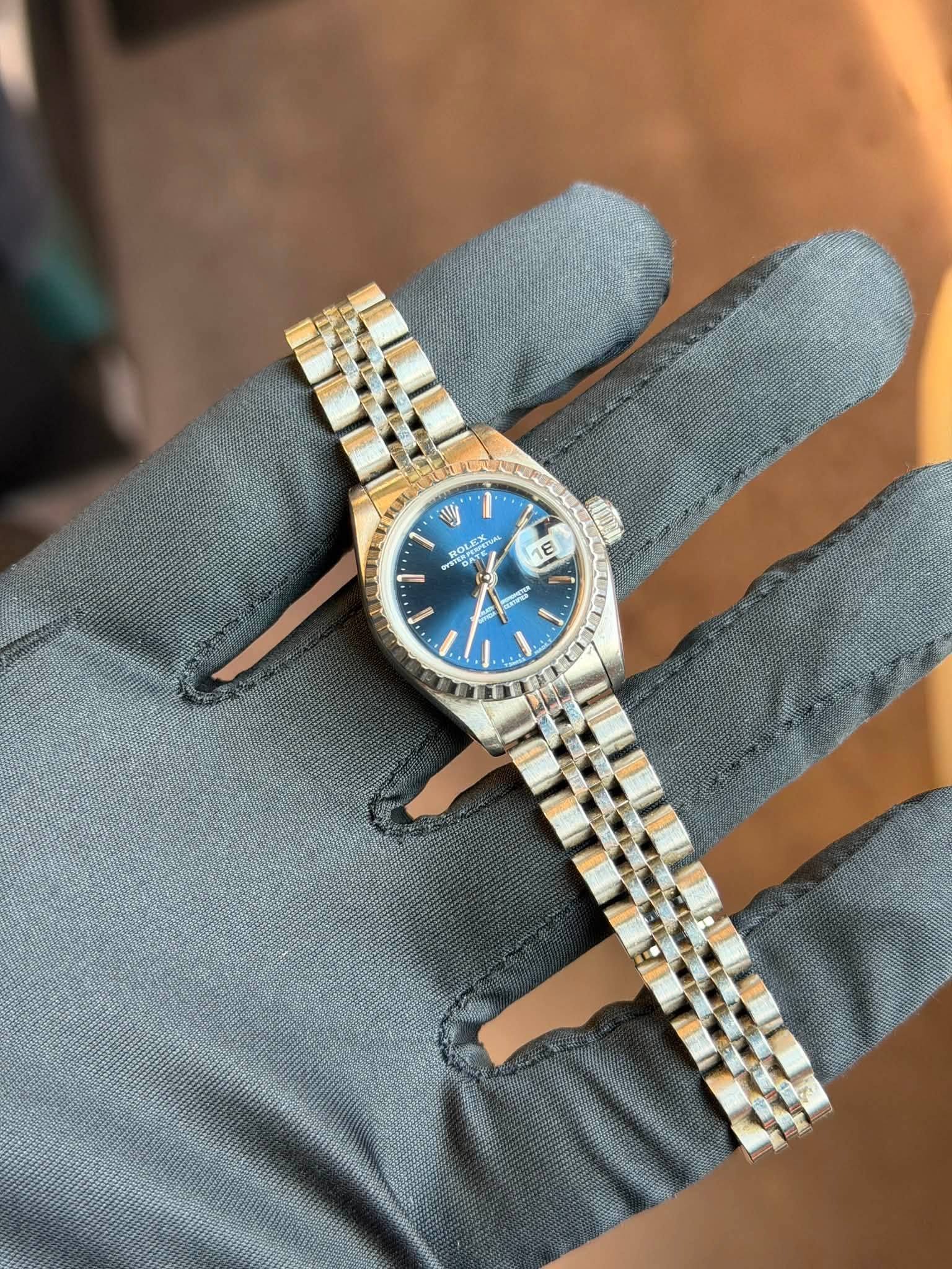 May be an image of wrist watch and text