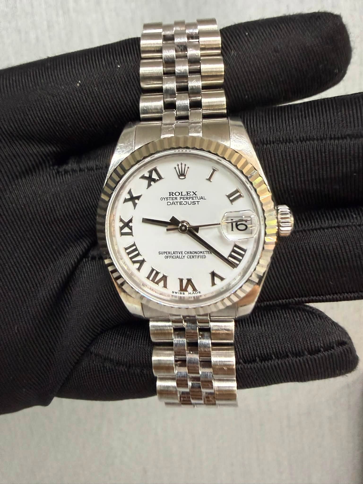 May be an image of wrist watch and text that says 'XXI XI W I X ROLEX X OYSTER ISTER OYSROLEXUAL TERPERPETUAL PERPETUAL SUAL UAL DATE DATEJUST II IX yW TERLAT SUPT…
