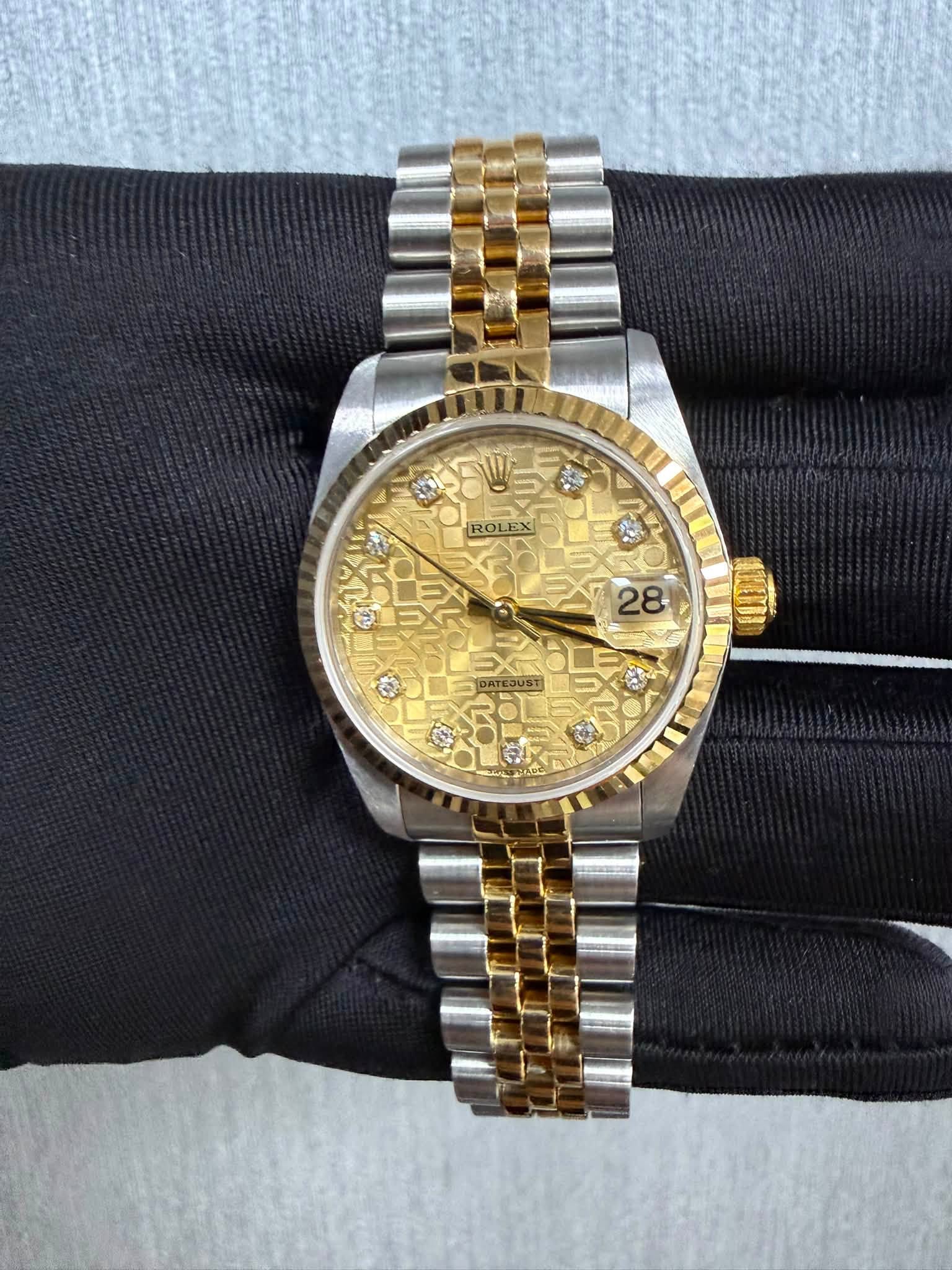 May be an image of wrist watch and text