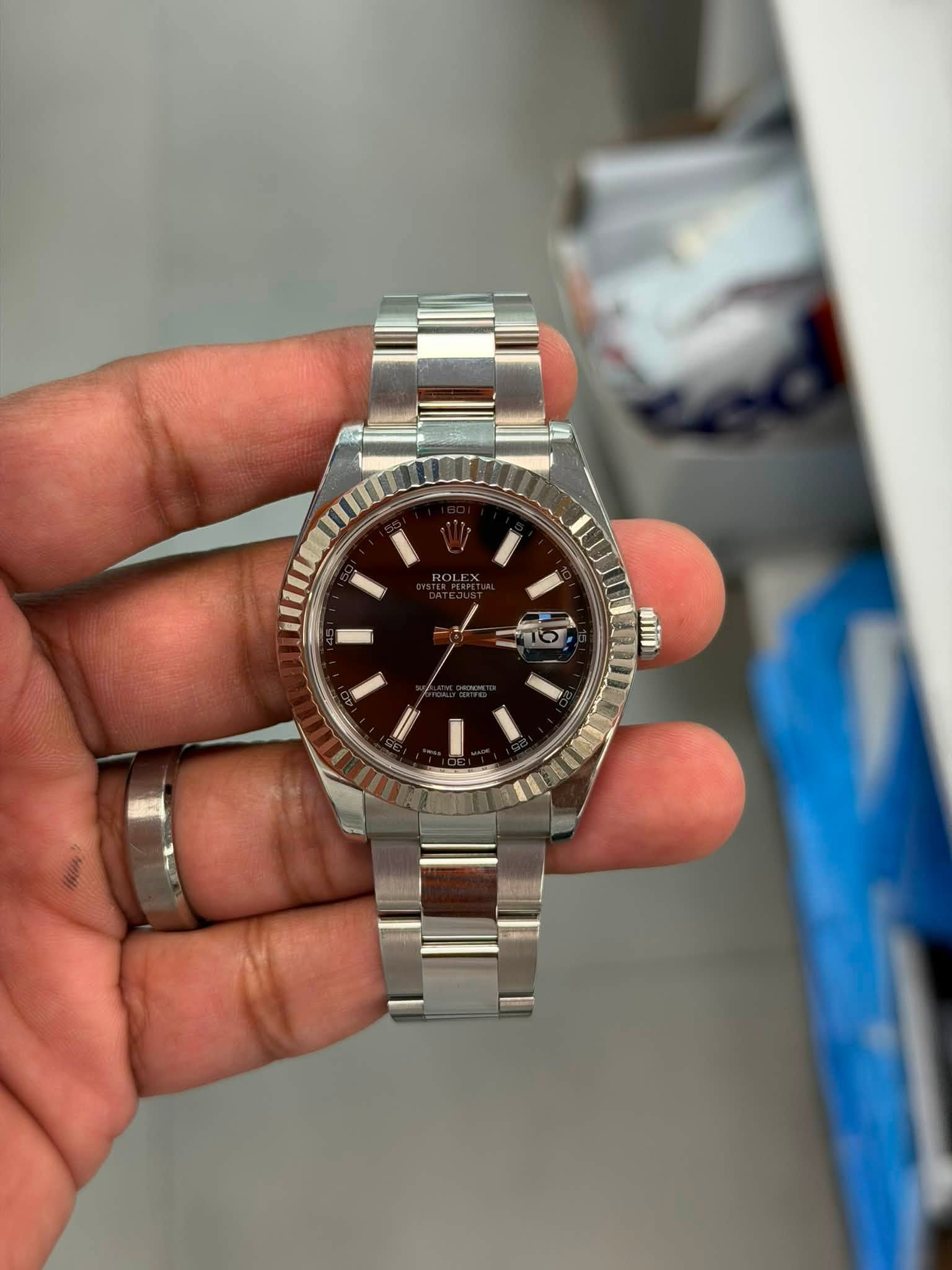 May be an image of wrist watch and text