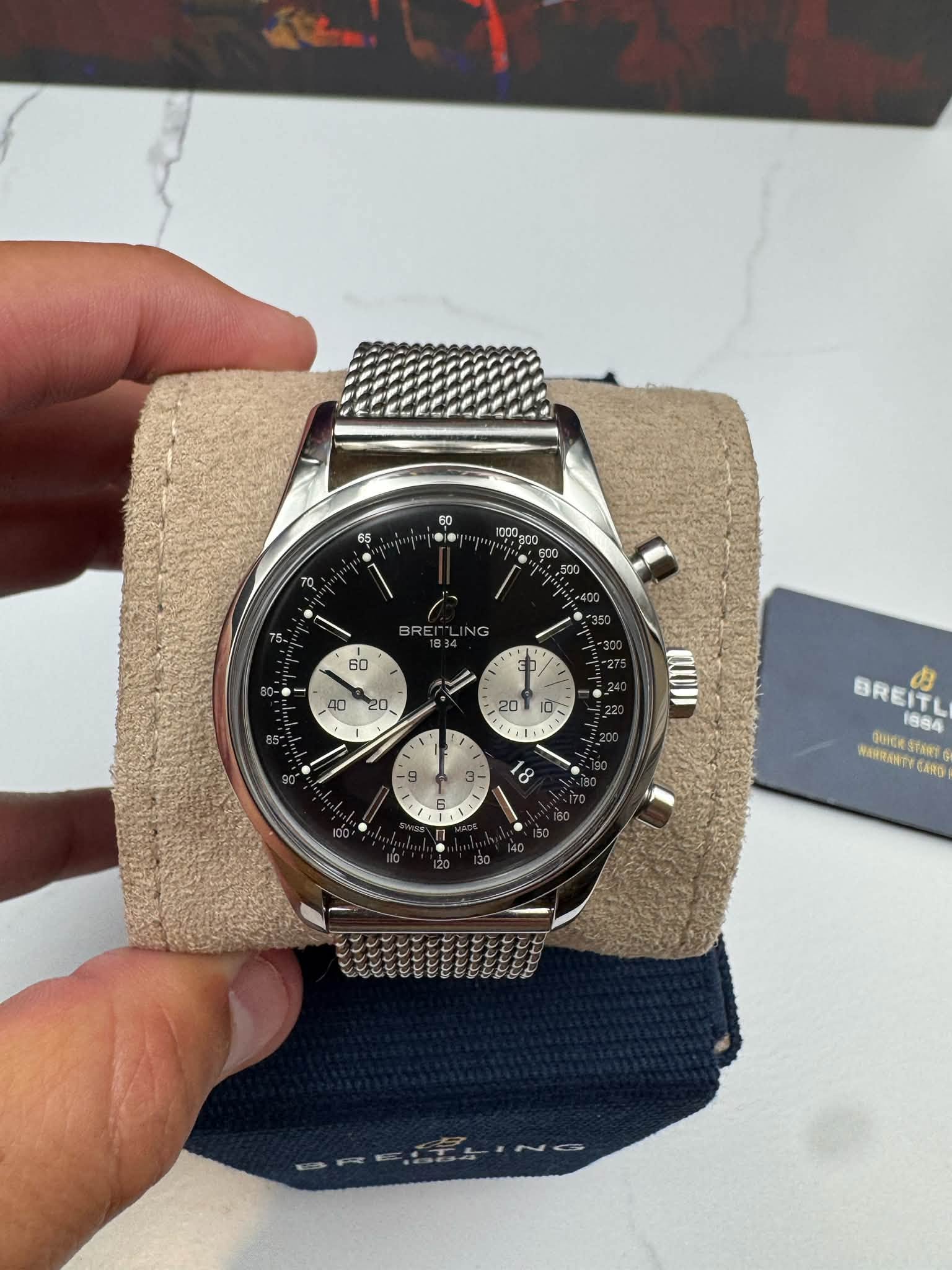 May be an image of wrist watch and text that says '65 60 1000g0 ㅎ 75 BREI 60 40 20. ปัง 20 1E1 1 M 9 3 8 1 I BREITL BREIT 1884 ФOPCK ИИR EStaRs StaRt GANG'