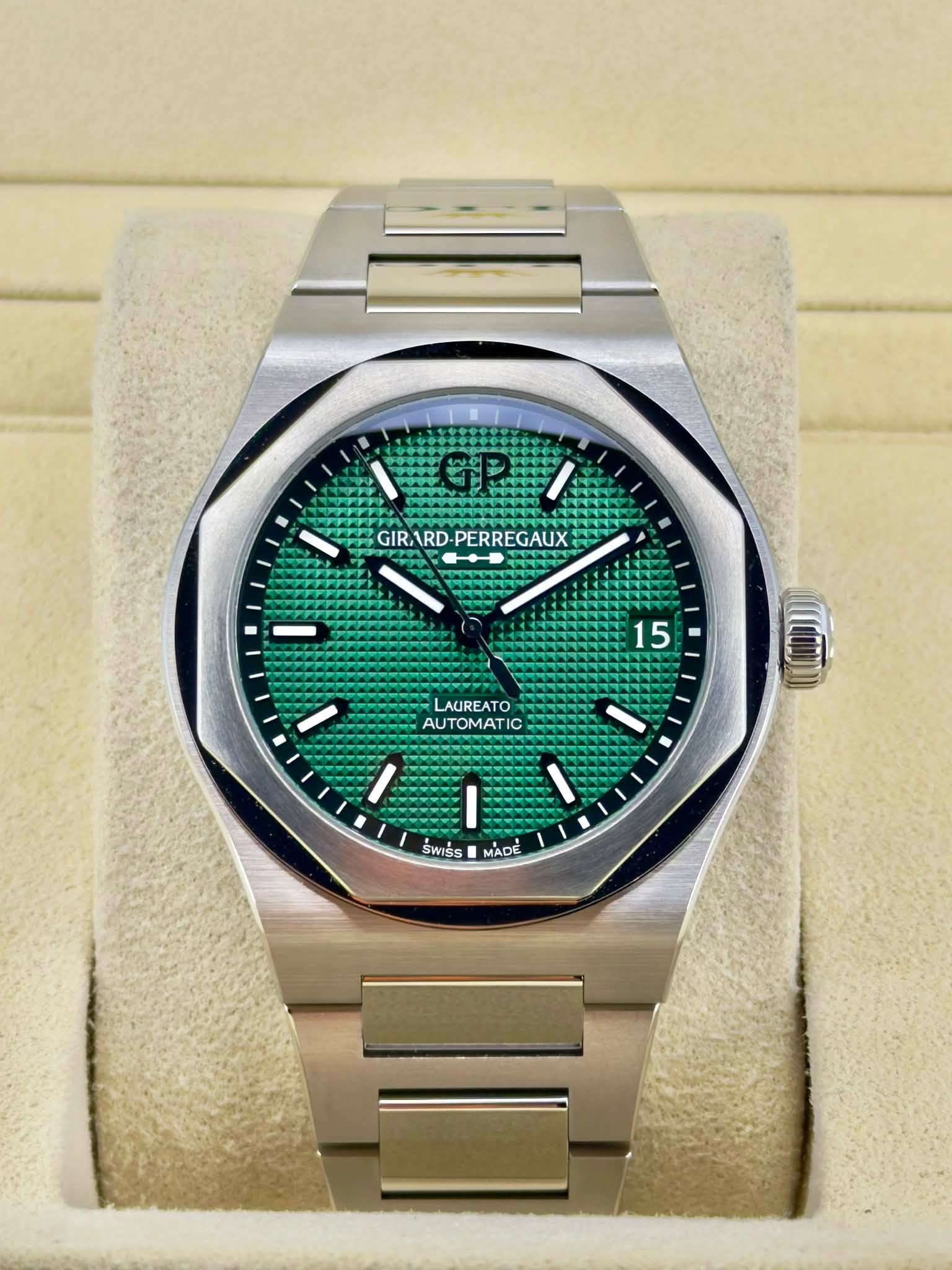 May be an image of wrist watch and text that says 'ト GIRARD GIRARD-PERREGAUX RD- PERREGAUX GAUX GIR 15 LAUREATO AUTOMATIC SWISS MADE'