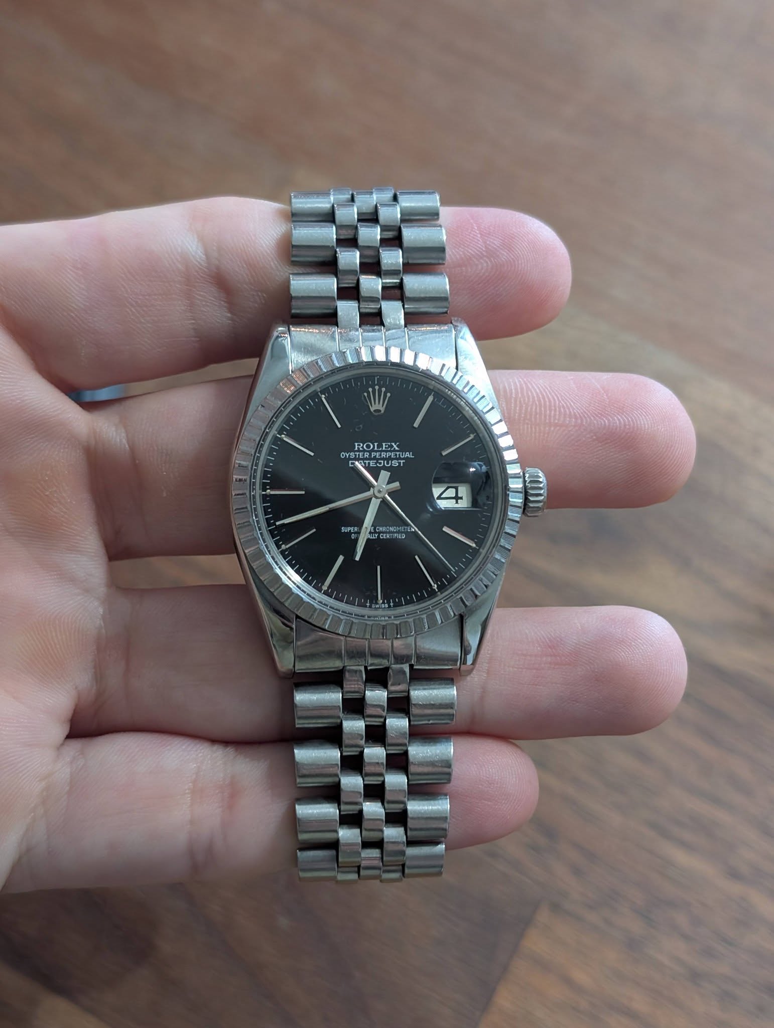 May be an image of wrist watch and text