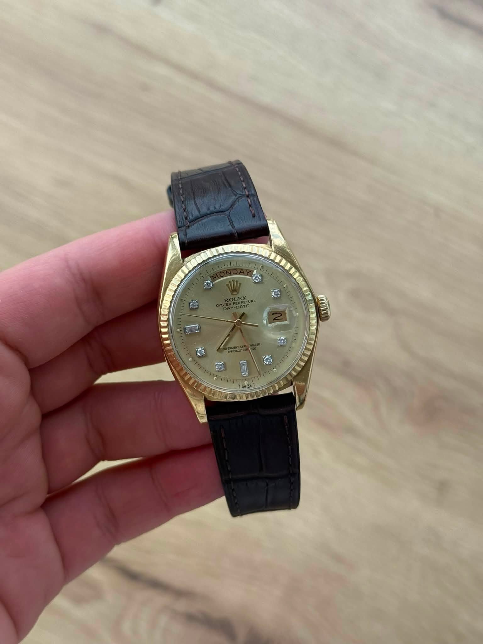 May be an image of wrist watch and text