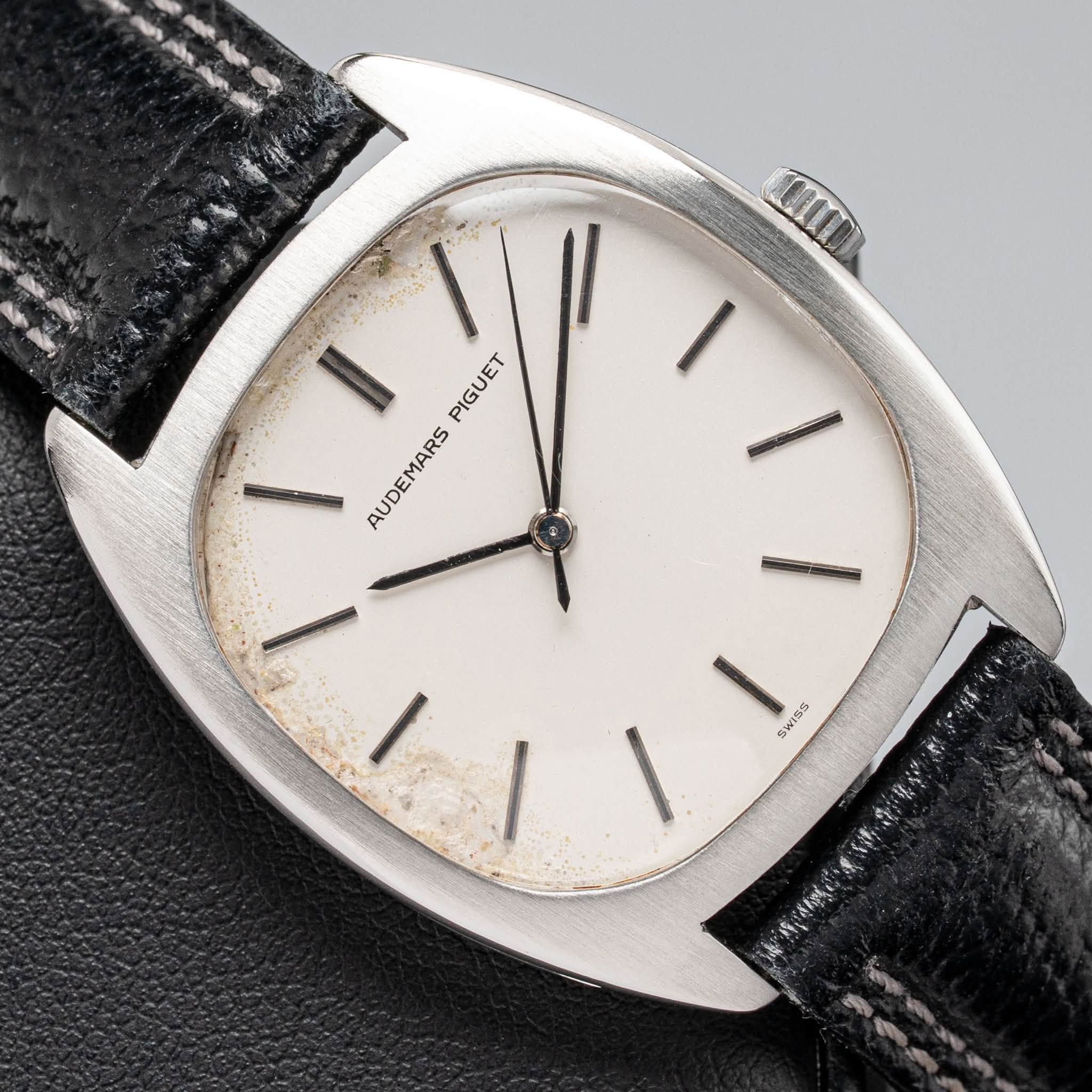 May be an image of wrist watch and text