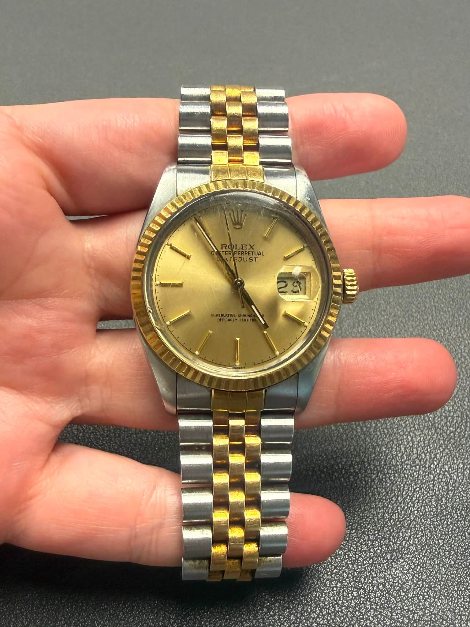 May be an image of wrist watch and text