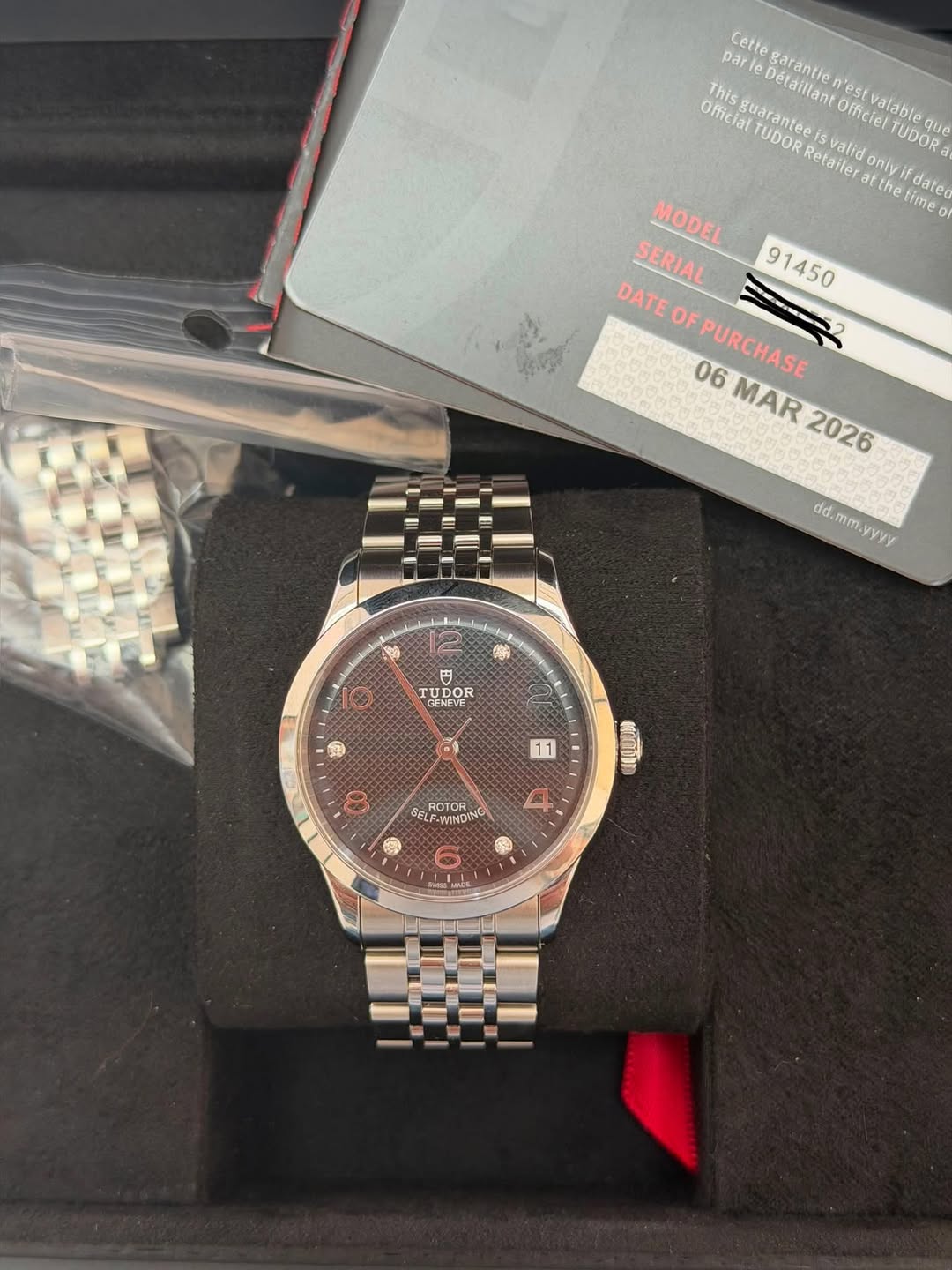 May be an image of wrist watch and text