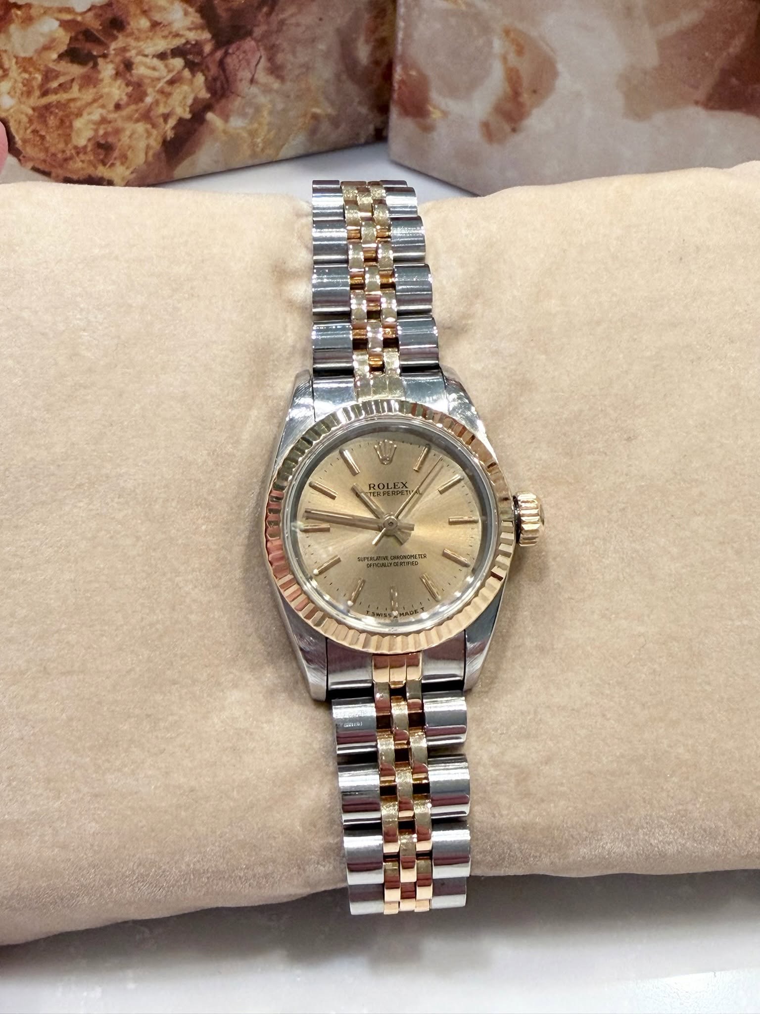 May be an image of wrist watch and text