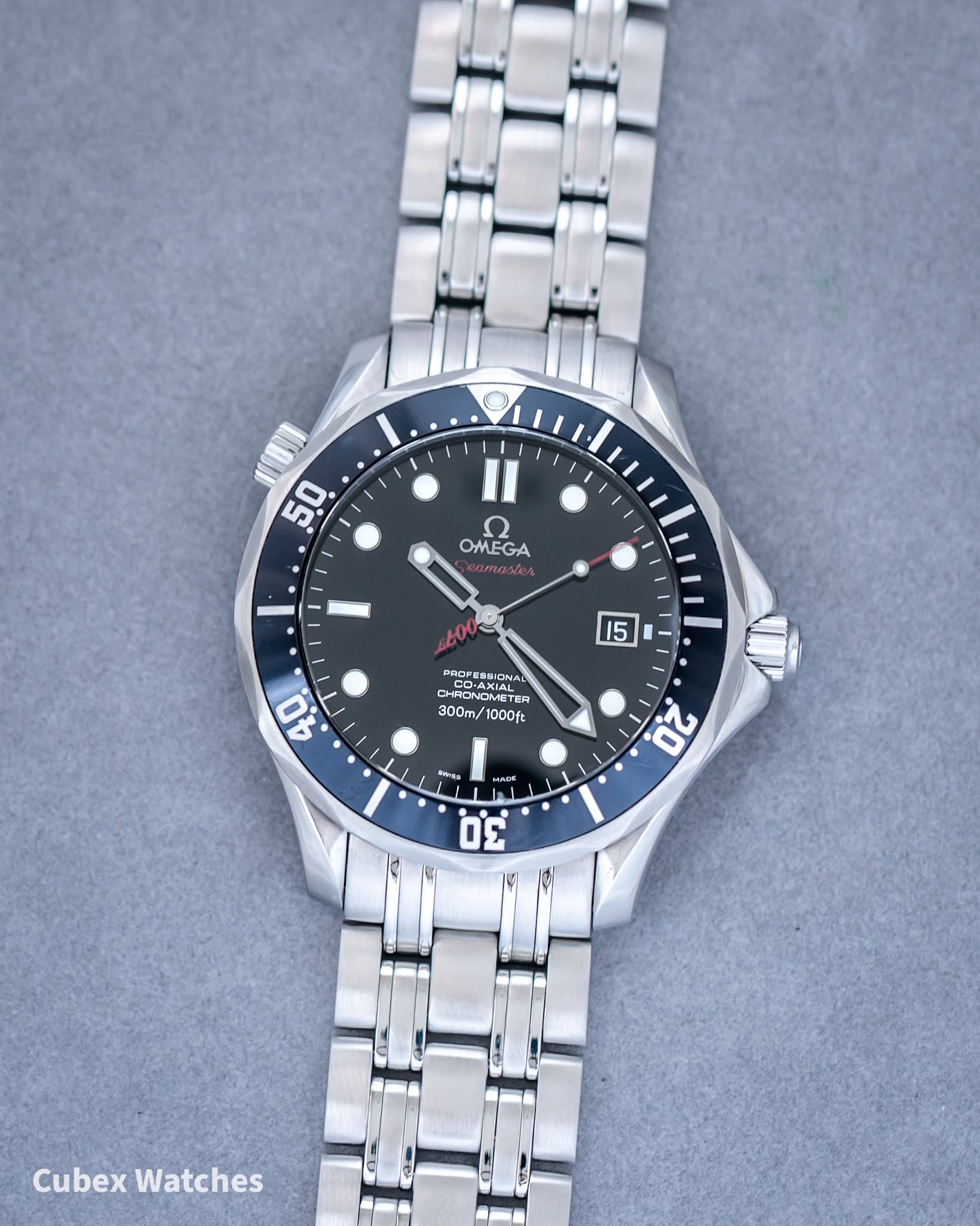 May be an image of wrist watch and text that says '50 II OMEGA aster 15 DASPESSIONA BRSPEMSIDNA אבו Gロー.ン CO-AXI COAXIAL CHRONOM ም METE TEA ER 300m/ 1000ft 40 a សមាយ 20 3.0…