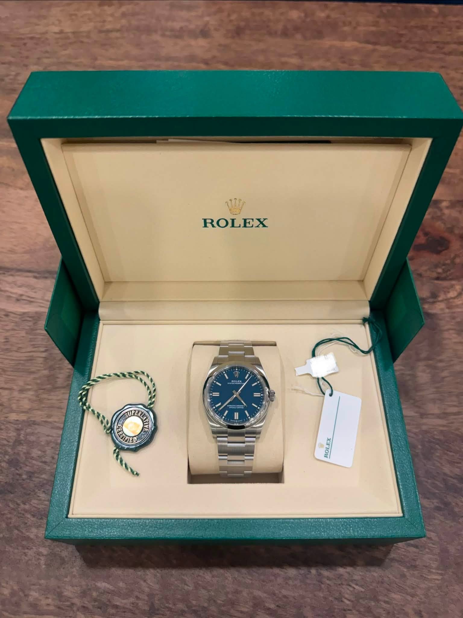 May be an image of wrist watch and text that says 'ROLEX ROLEX'