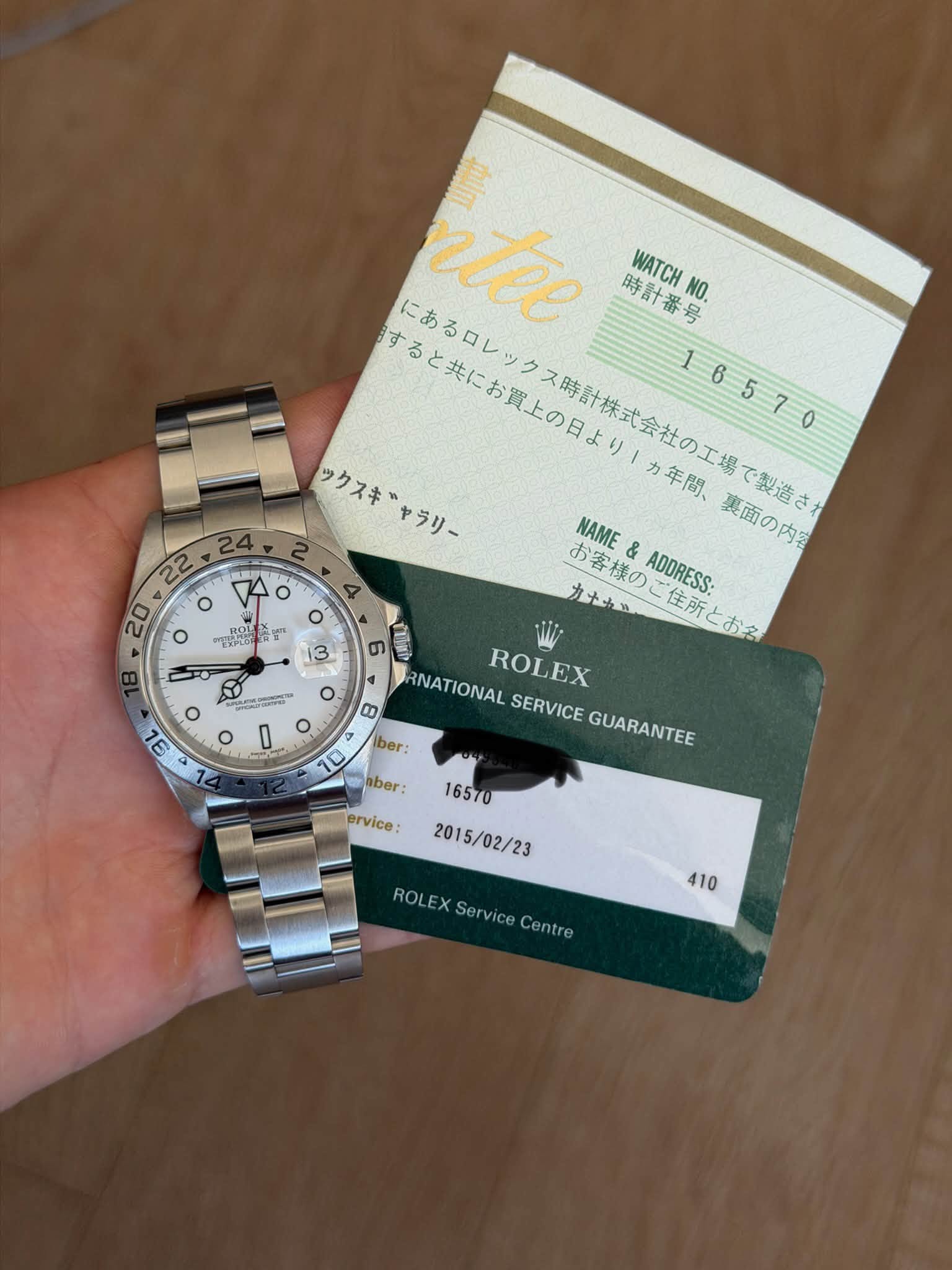 May be an image of money, wrist watch, ticket stub and text that says 'すると共にお賢上の日より1カ年問、 にあるロレックス時計株式会社の工場で朝造き で製造さ にあるロレッ ク ntee 時計番号 WATCHNO. 16570 ックスキャラリー ックスキ カ年間、 NAME お客様の &…