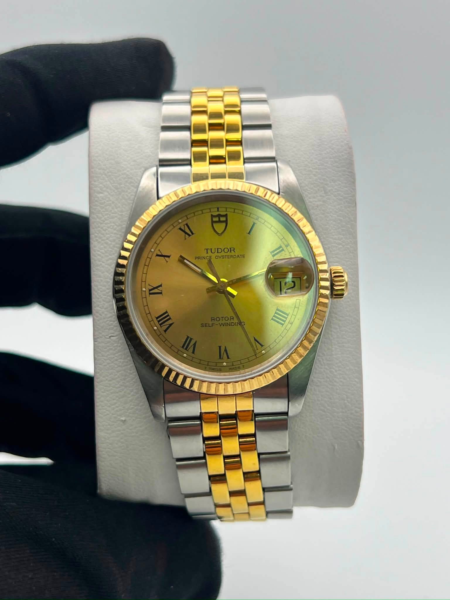May be an image of wrist watch and text that says 'TUDORAE TERDATE TUDOR 道 ወዝ IIII a 2'